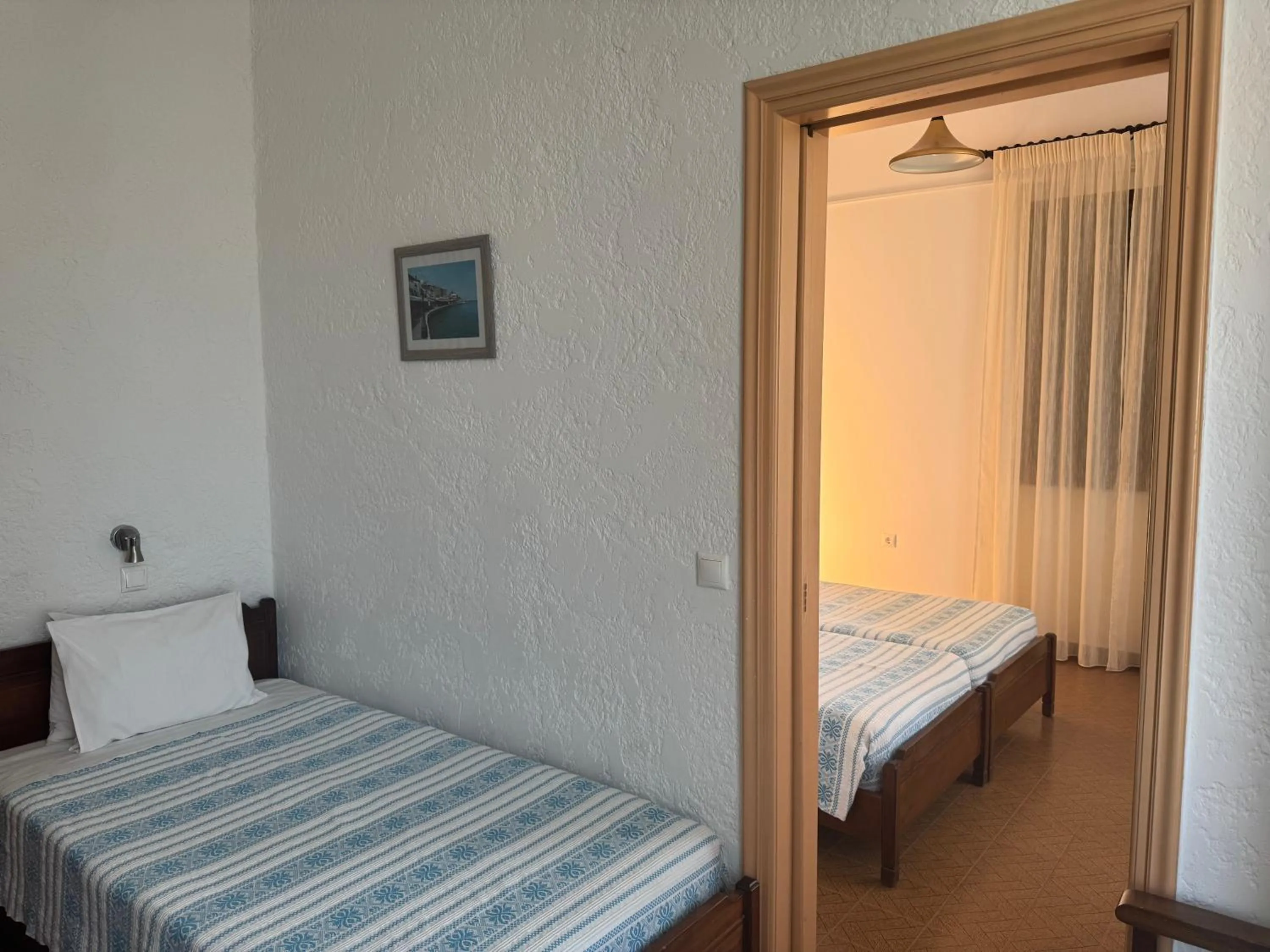 Bed in Pythaïs Hotel