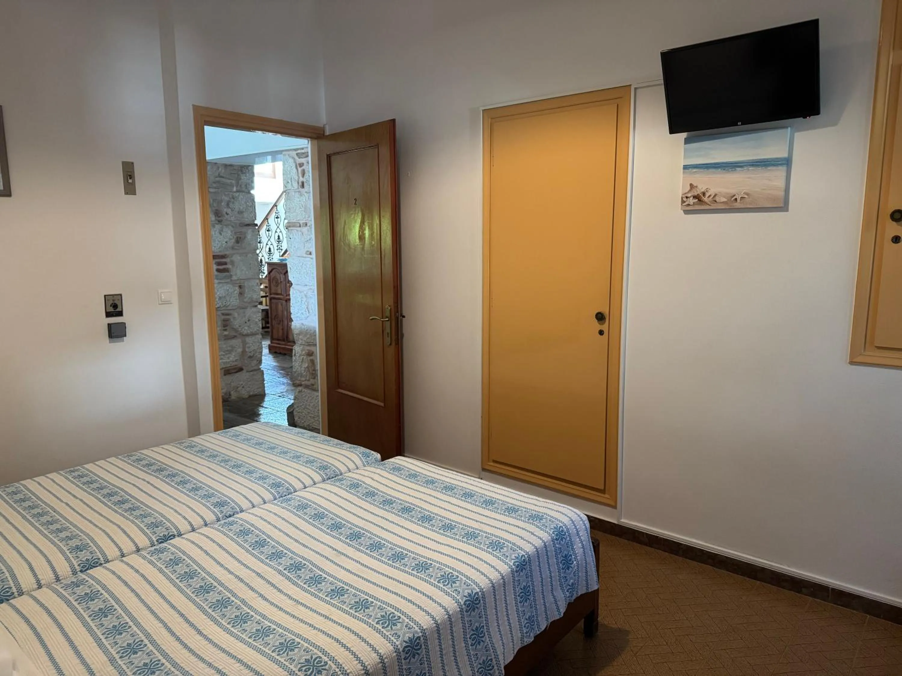 Bed in Pythaïs Hotel