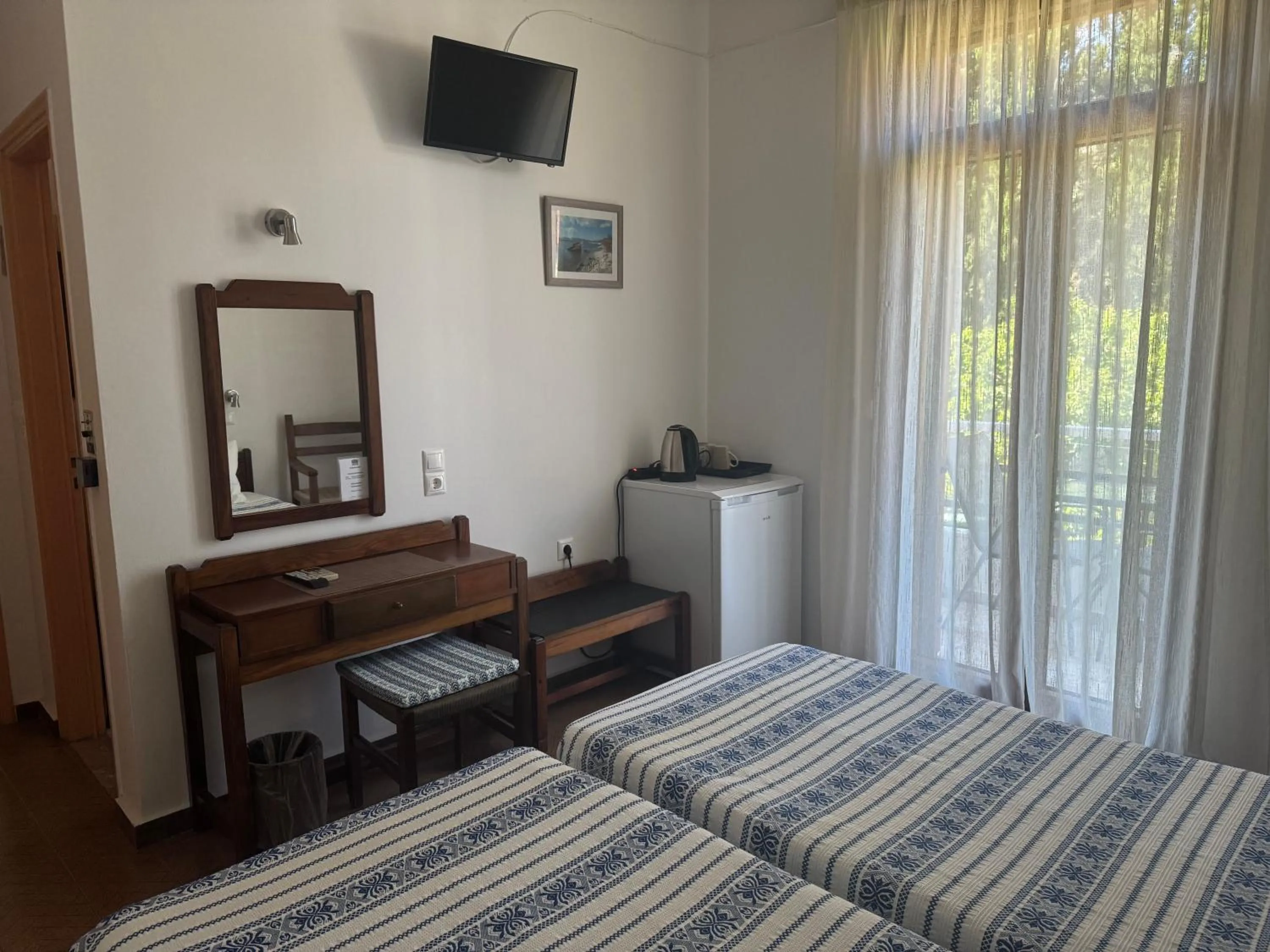 Bed in Pythaïs Hotel