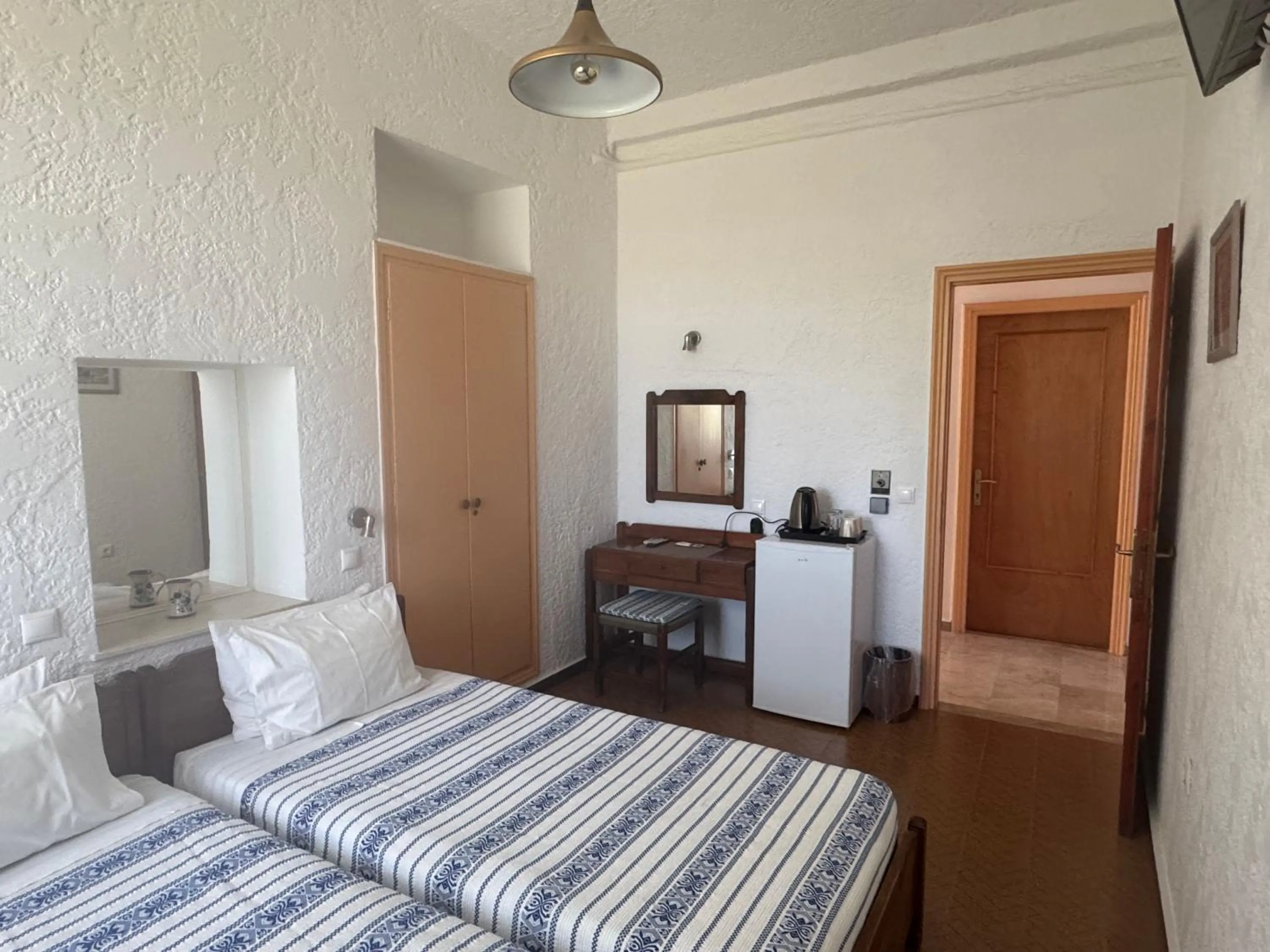 Bed in Pythaïs Hotel