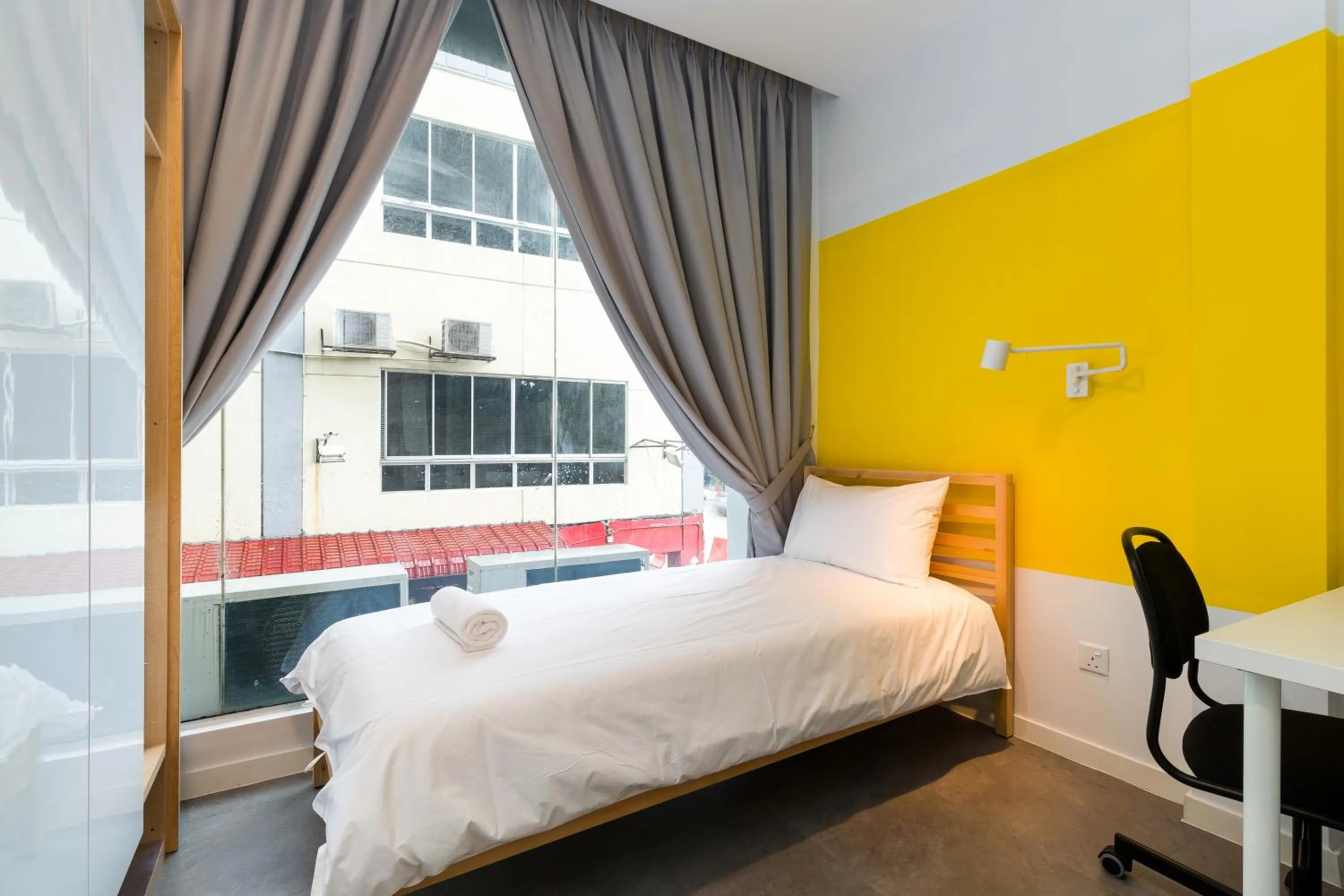 Bed in Upstairs Downstairs CoLiving Kampung Pandan