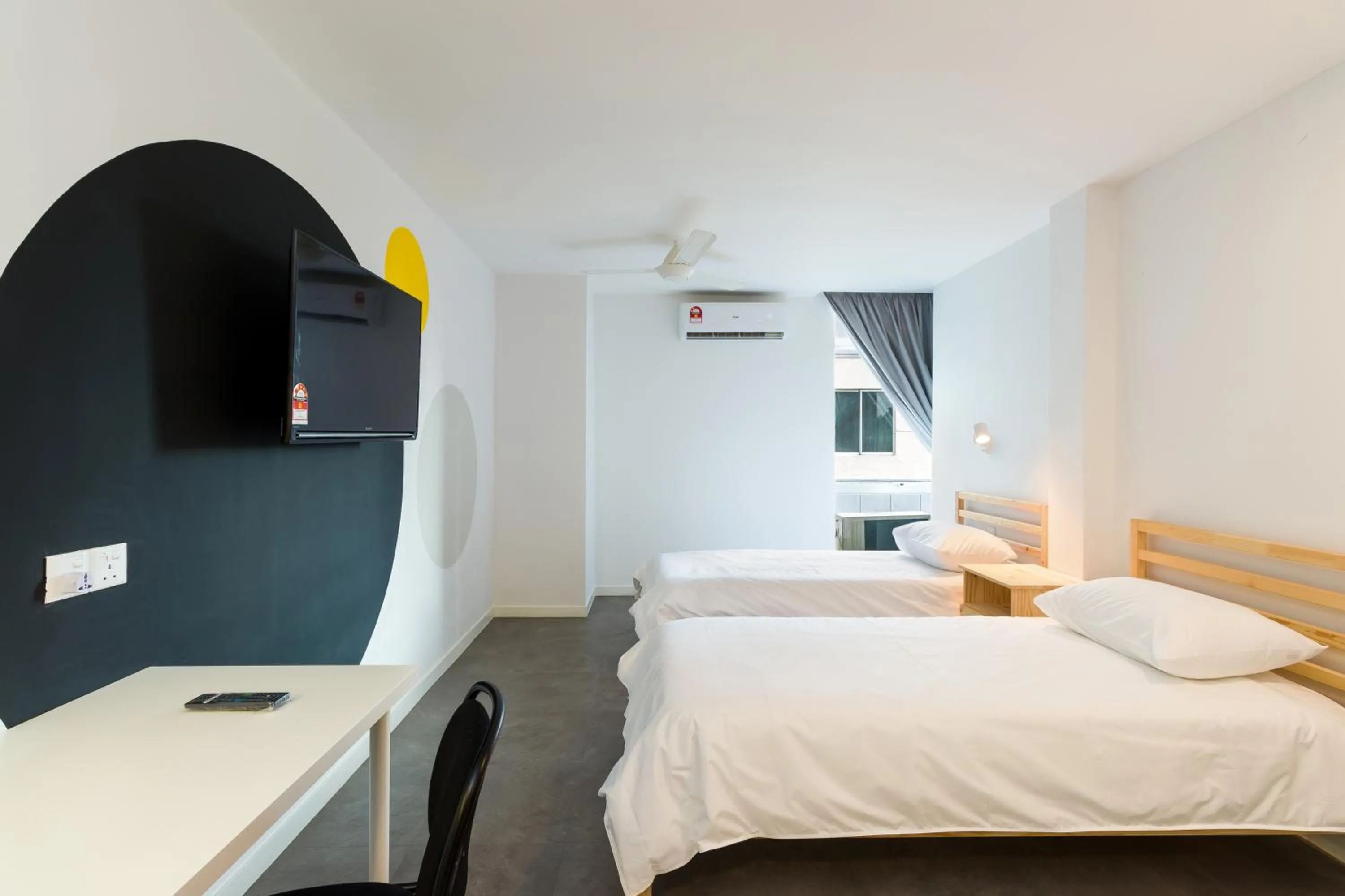 Bed in Upstairs Downstairs CoLiving Kampung Pandan