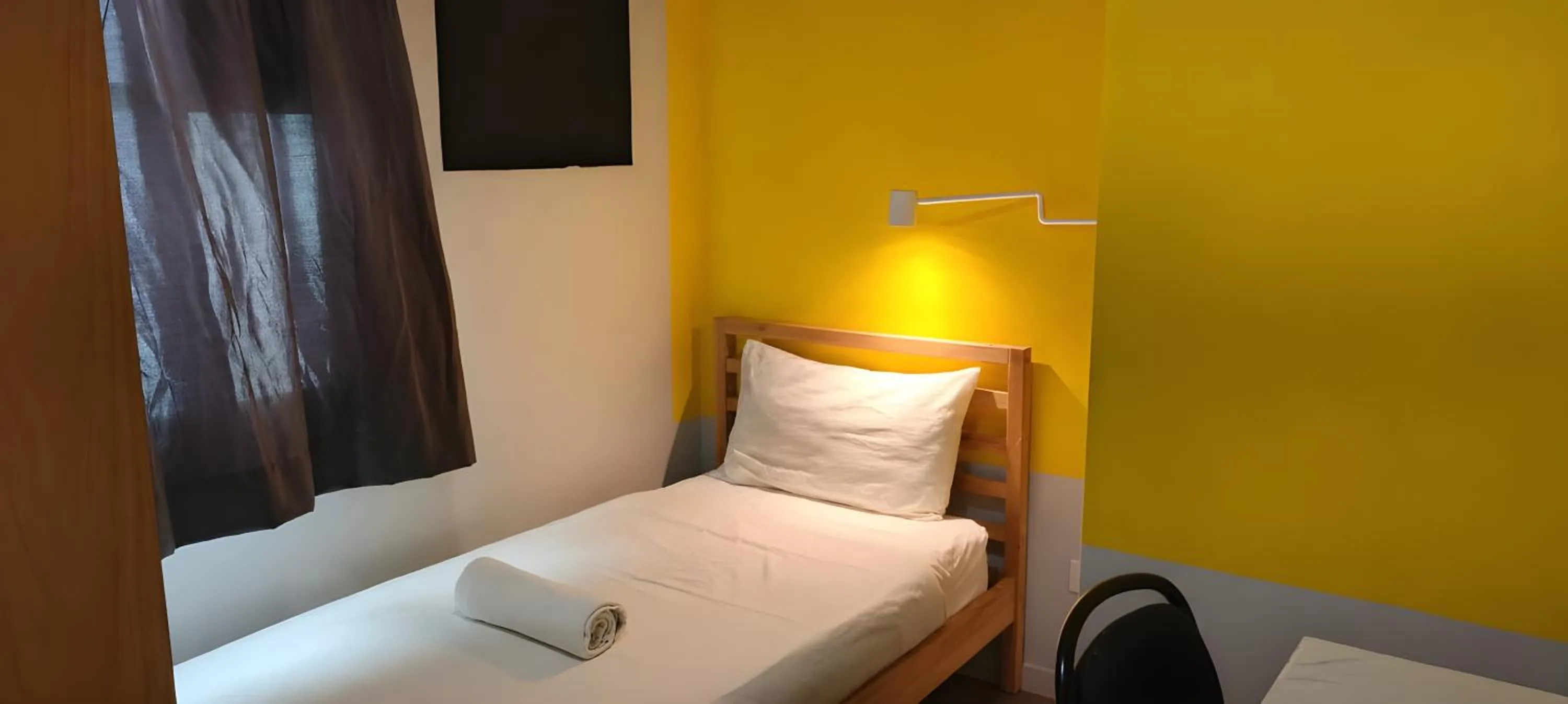 Bed in Upstairs Downstairs CoLiving Kampung Pandan