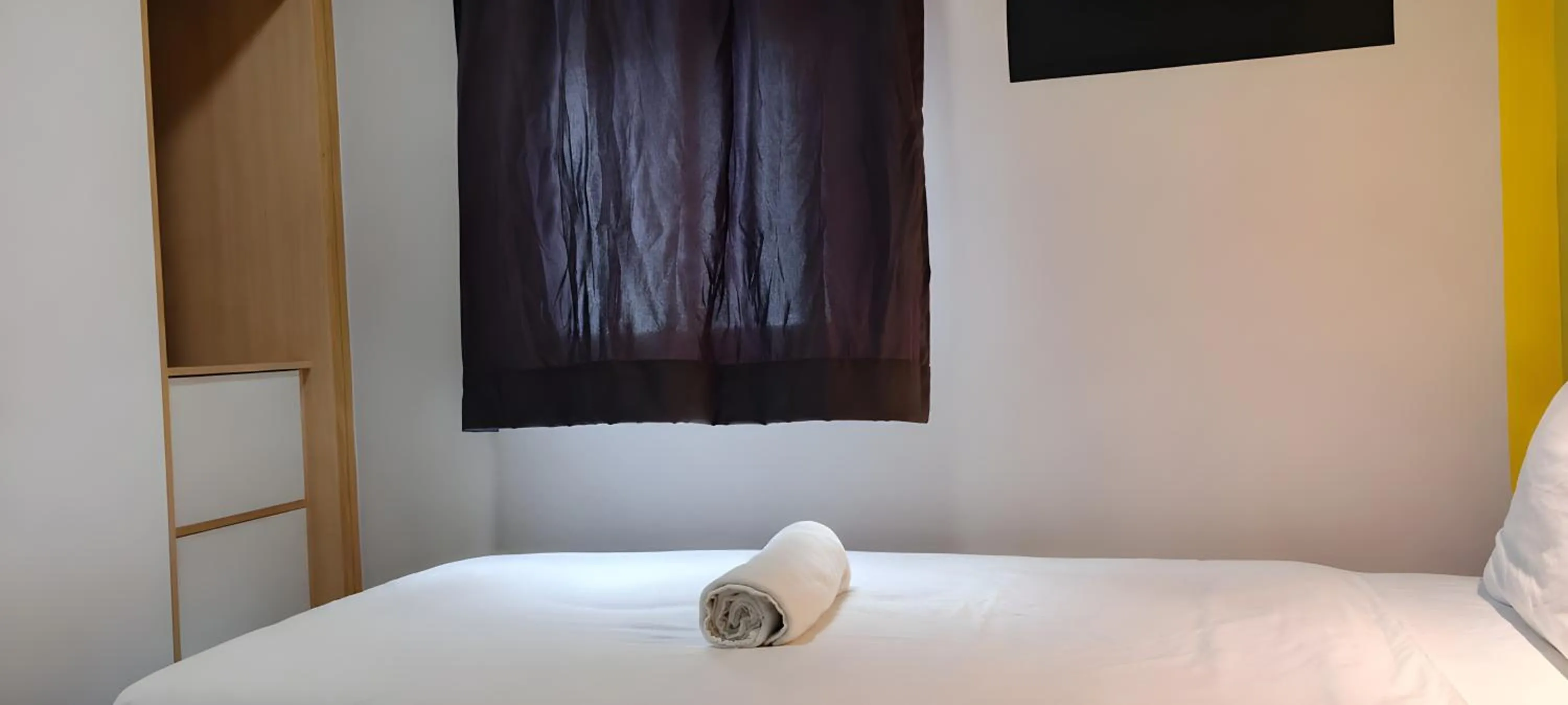Bed in Upstairs Downstairs CoLiving Kampung Pandan