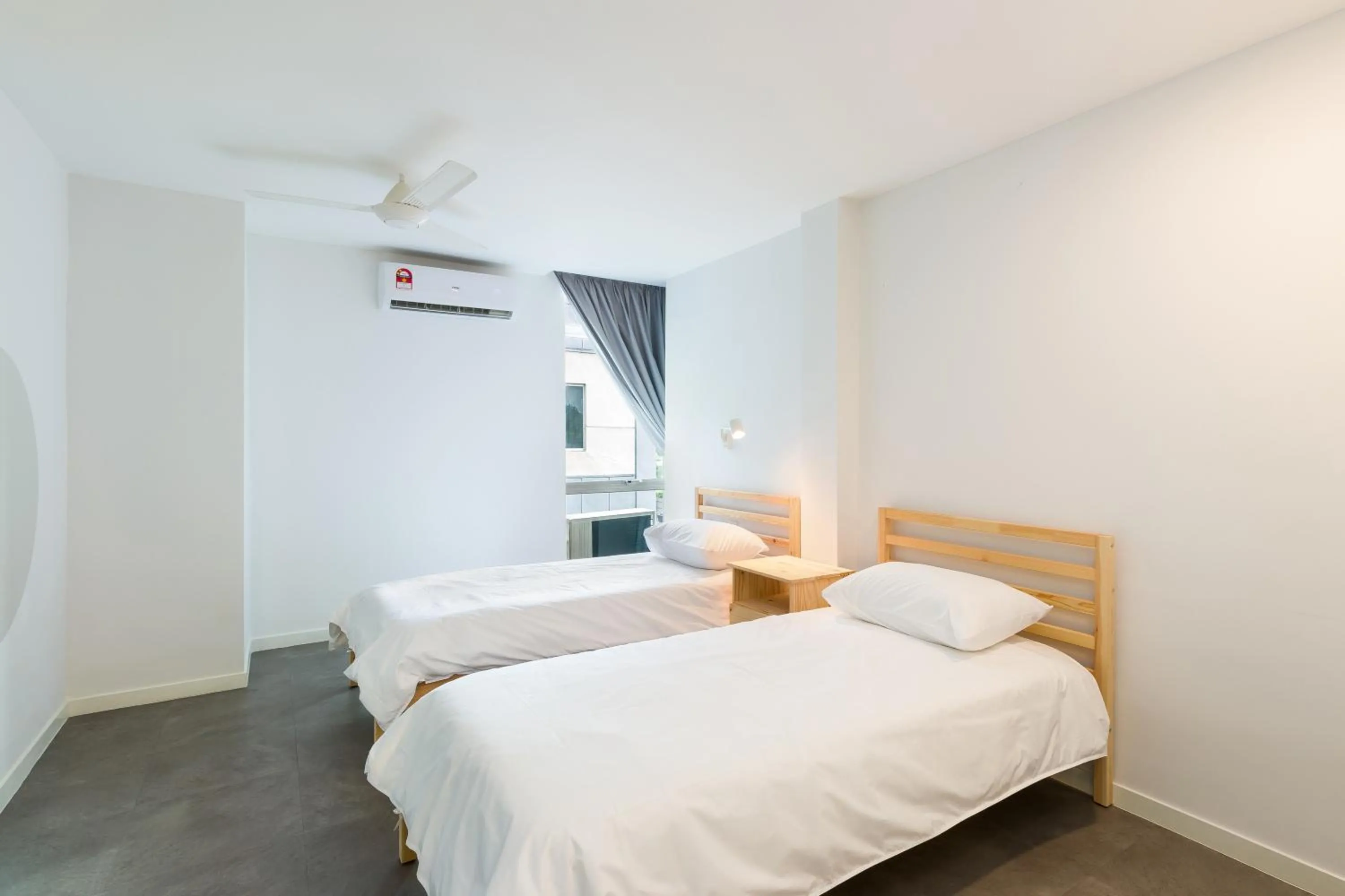 Bed in Upstairs Downstairs CoLiving Kampung Pandan