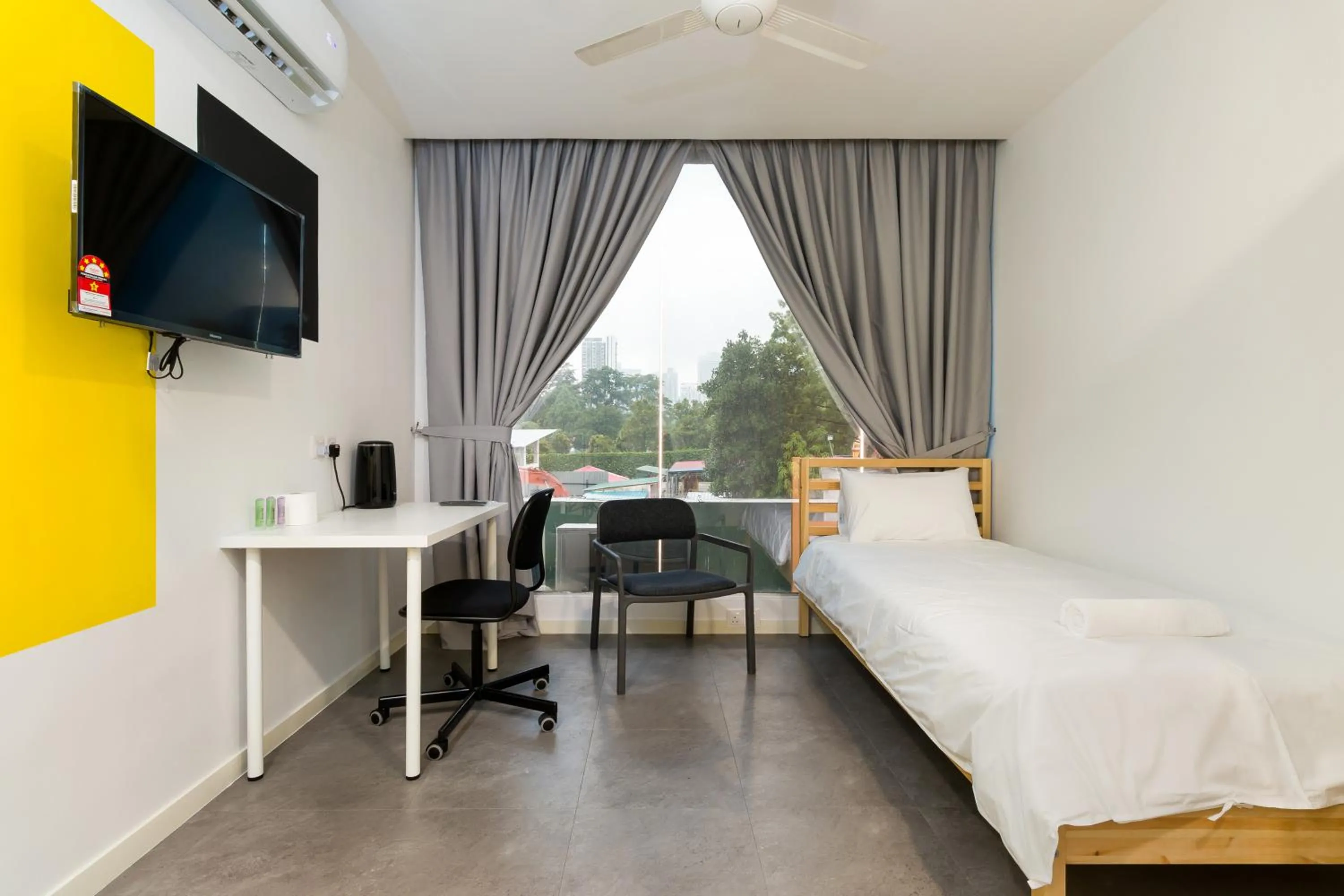 Bed in Upstairs Downstairs CoLiving Kampung Pandan