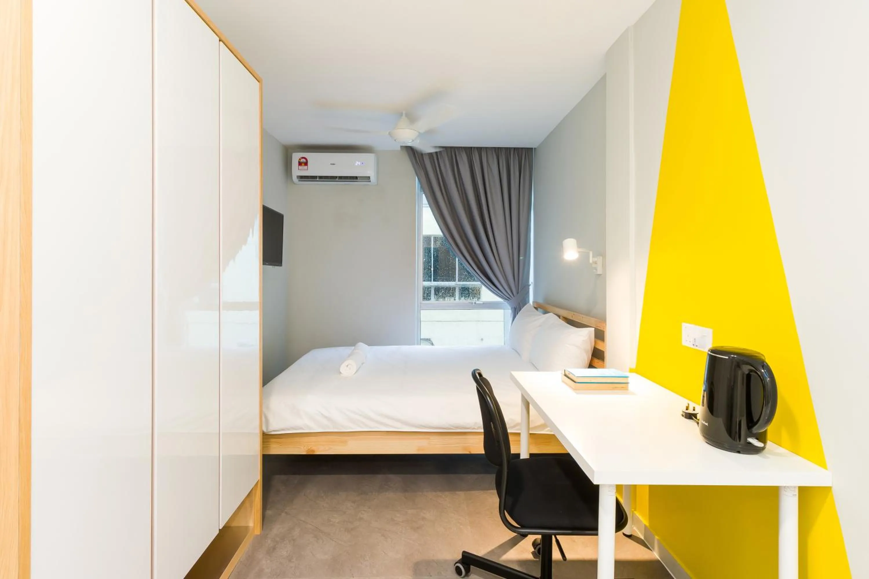 Bed in Upstairs Downstairs CoLiving Kampung Pandan