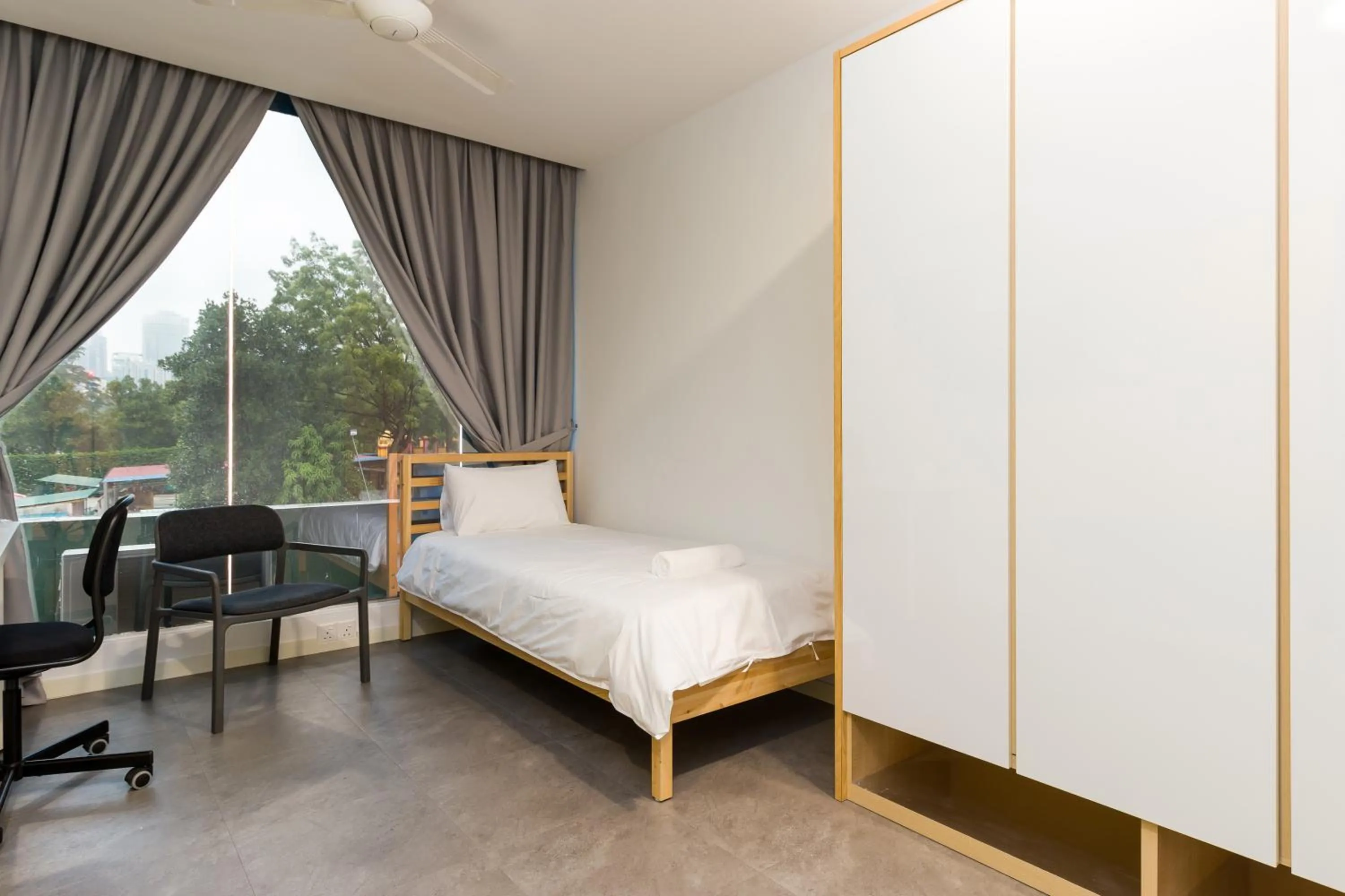 Bed in Upstairs Downstairs CoLiving Kampung Pandan