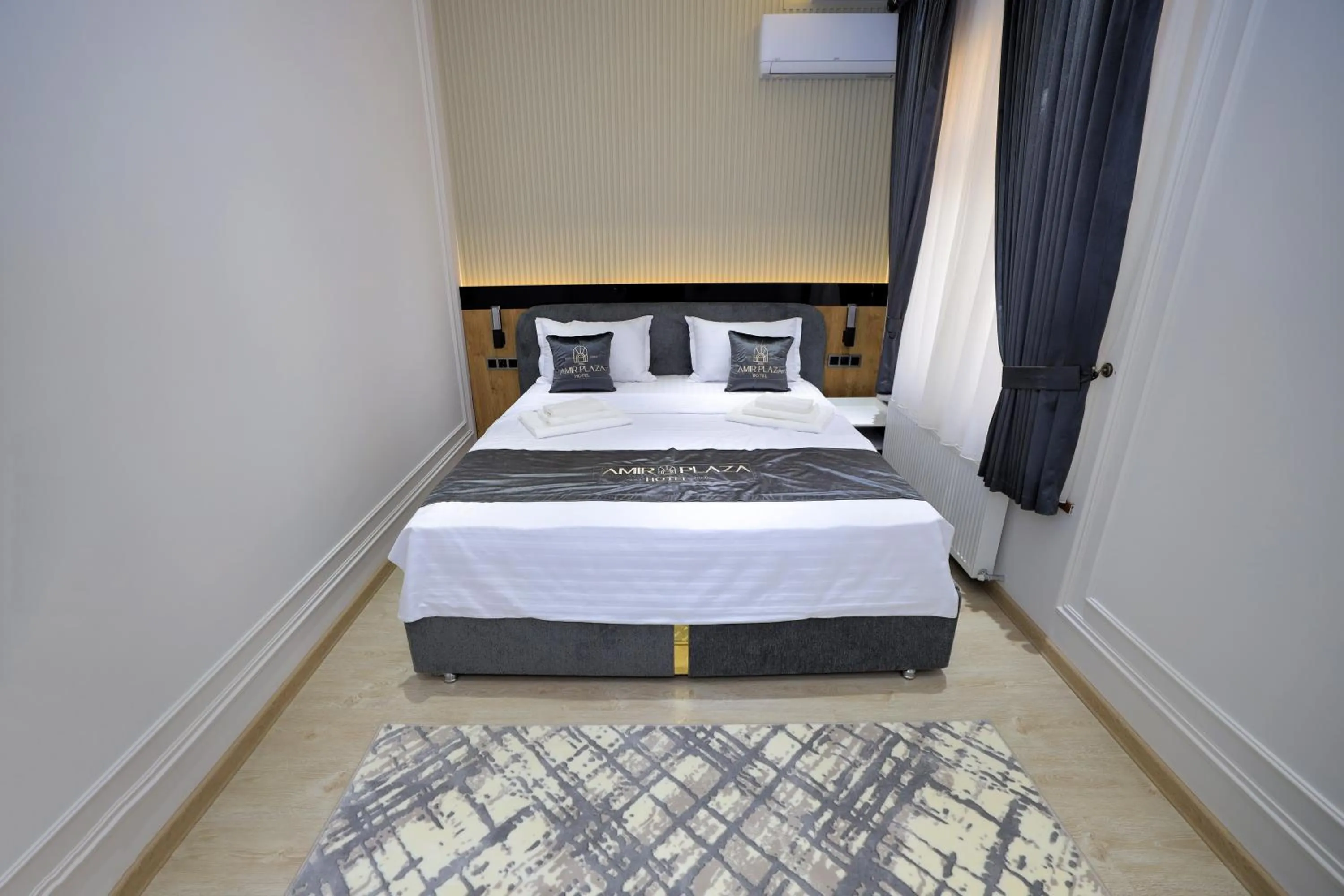 Bed in AMIR PLAZA hotel