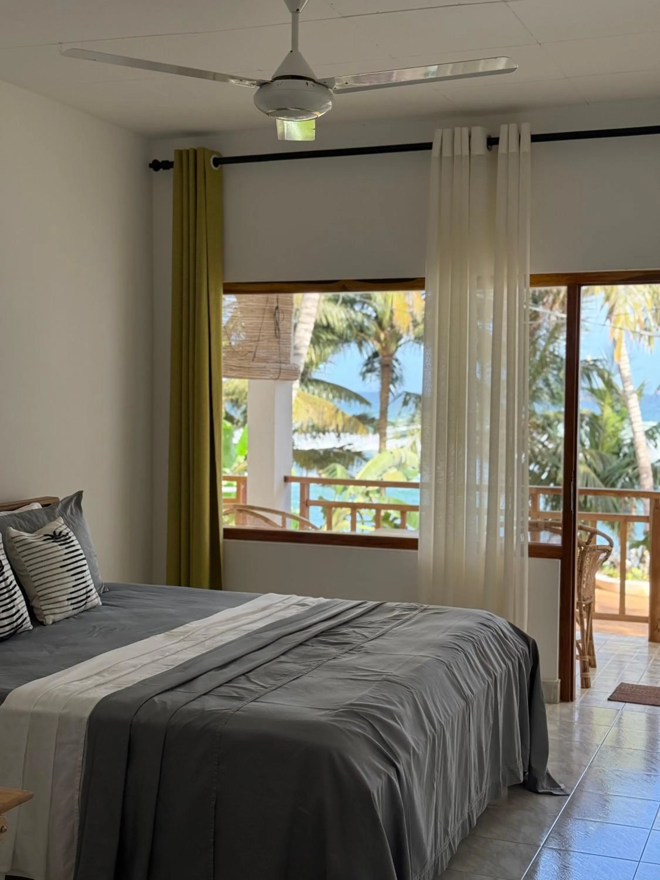 Bed in Coconut Palm beach restaurant and rooms