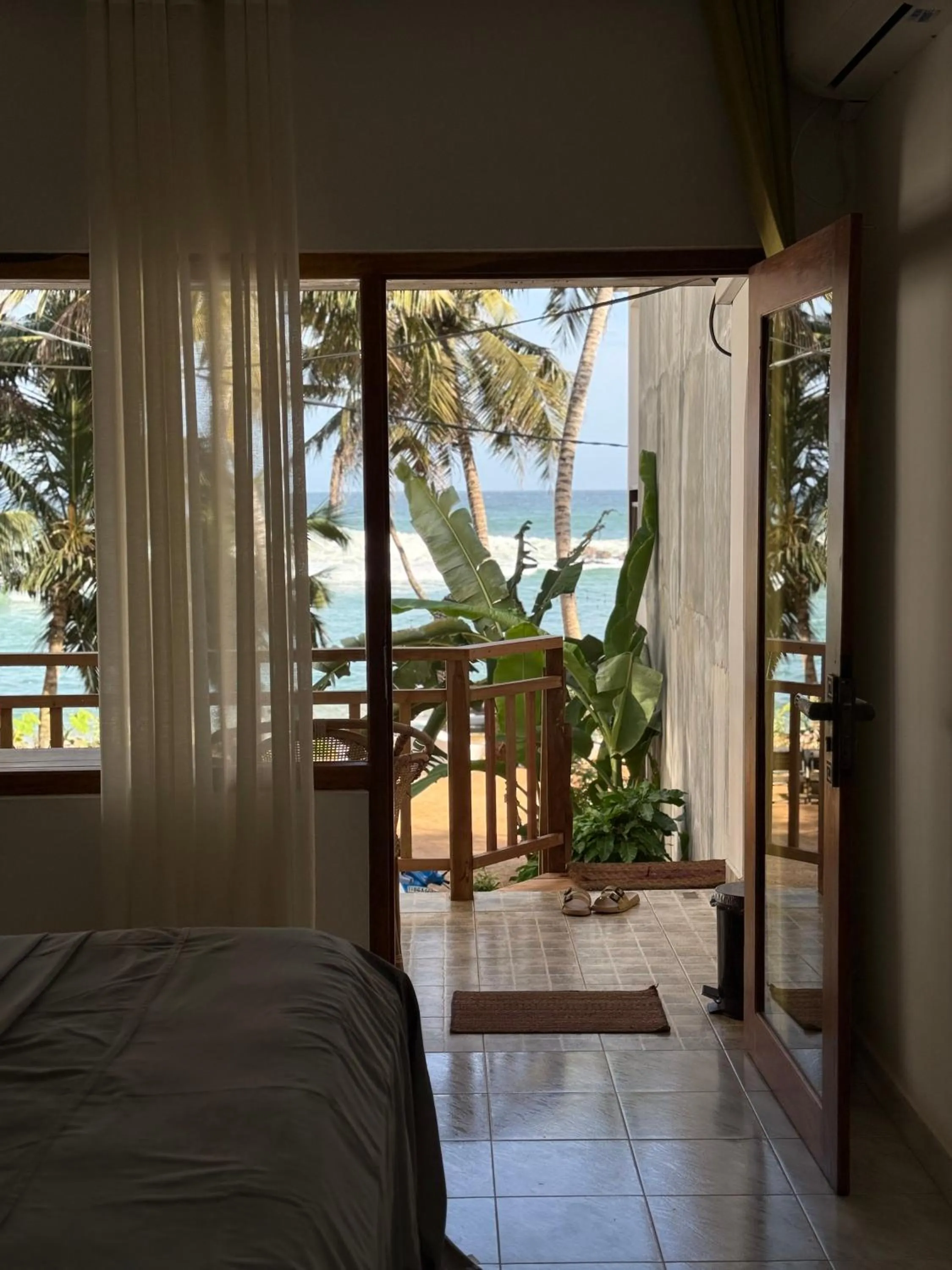 Bed in Coconut Palm beach restaurant and rooms