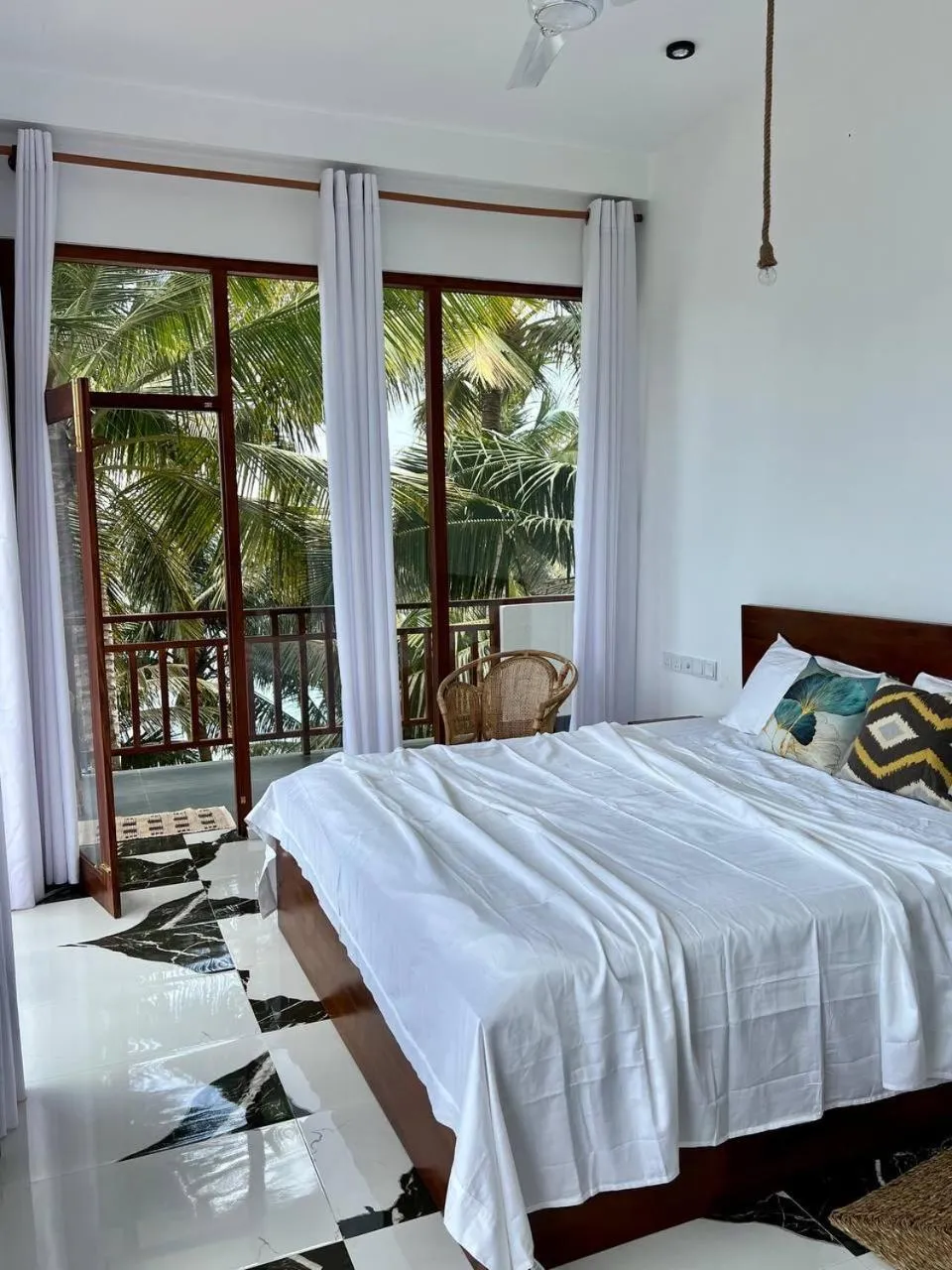 Bed in Coconut Palm beach restaurant and rooms