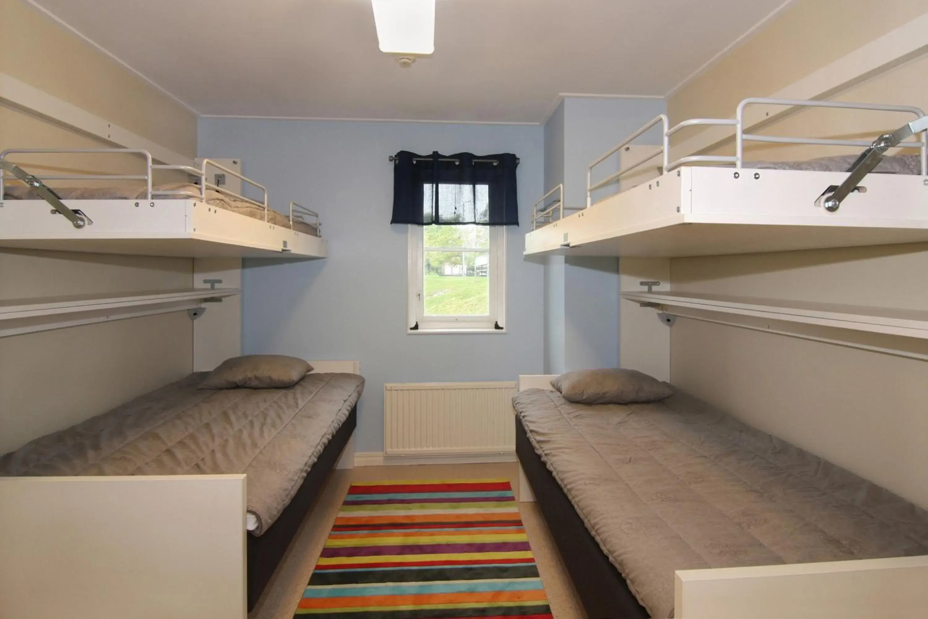 Standard Quadruple Room with Shared Bathroom in Bergs Slussar Vandrarhem & Stugor Standard Quadruple Room with Shared Bathroom in Bergs Slussar Vandrarhem & Stugor