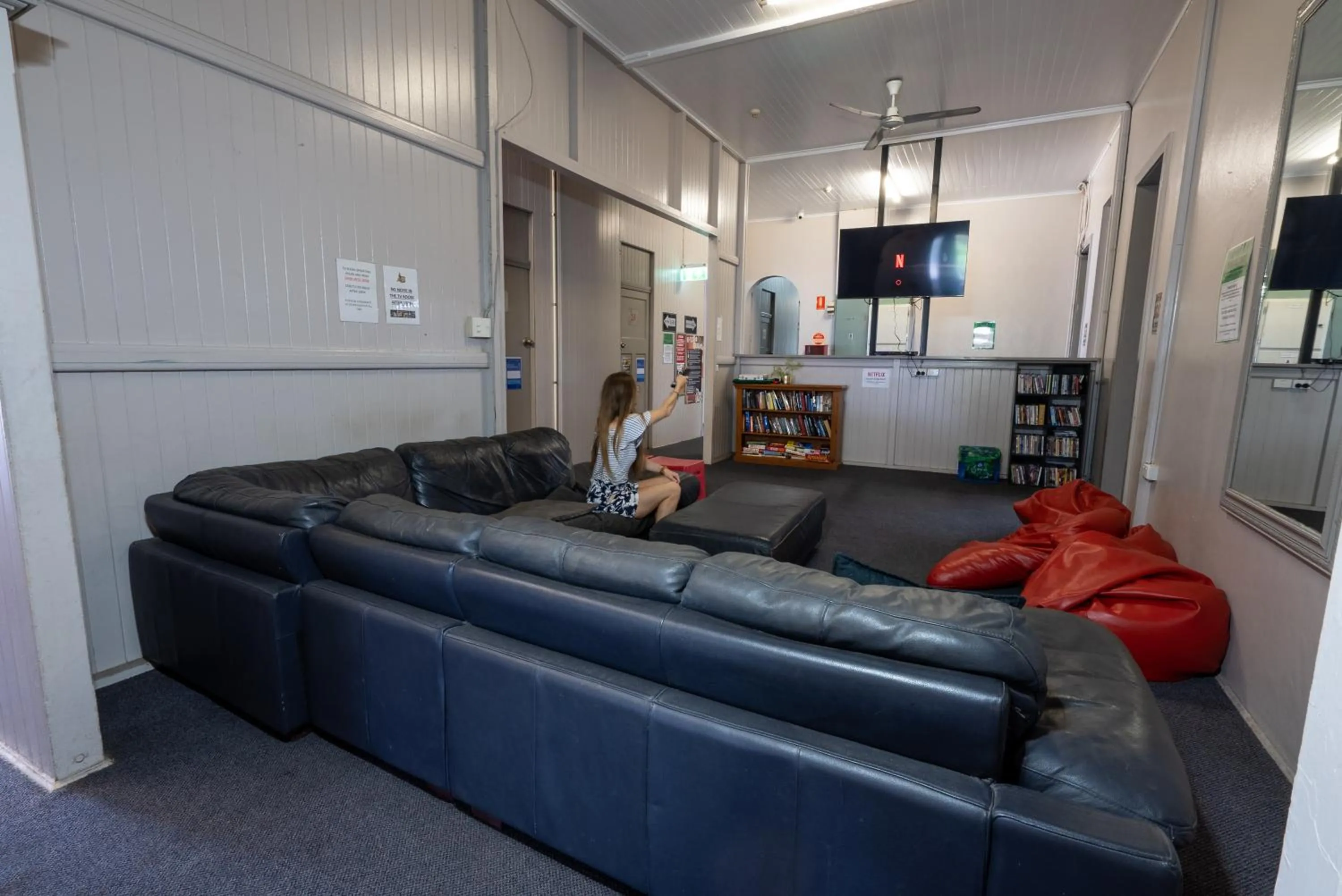 Communal lounge/ TV room in The Jack Backpackers