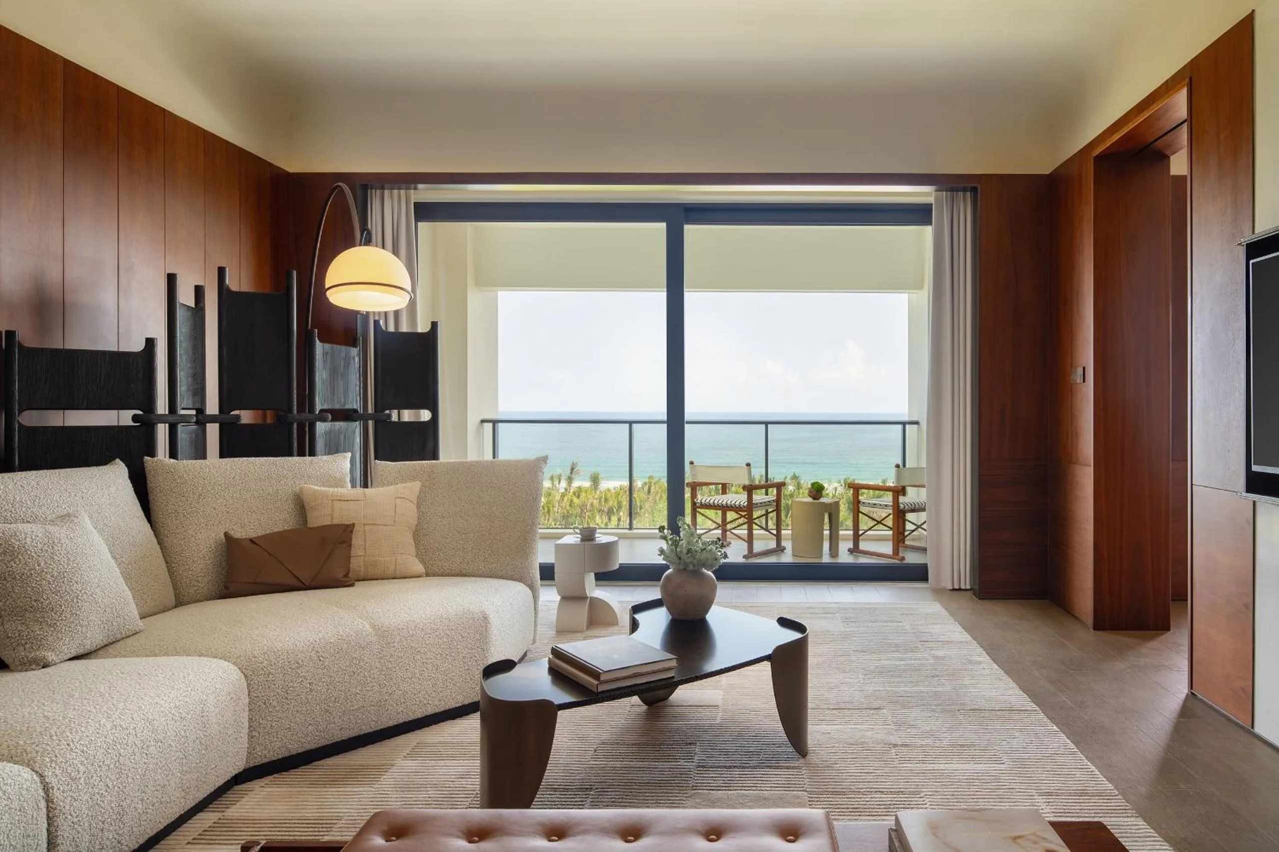 Living room in Kimpton Aqeos Hainan by IHG