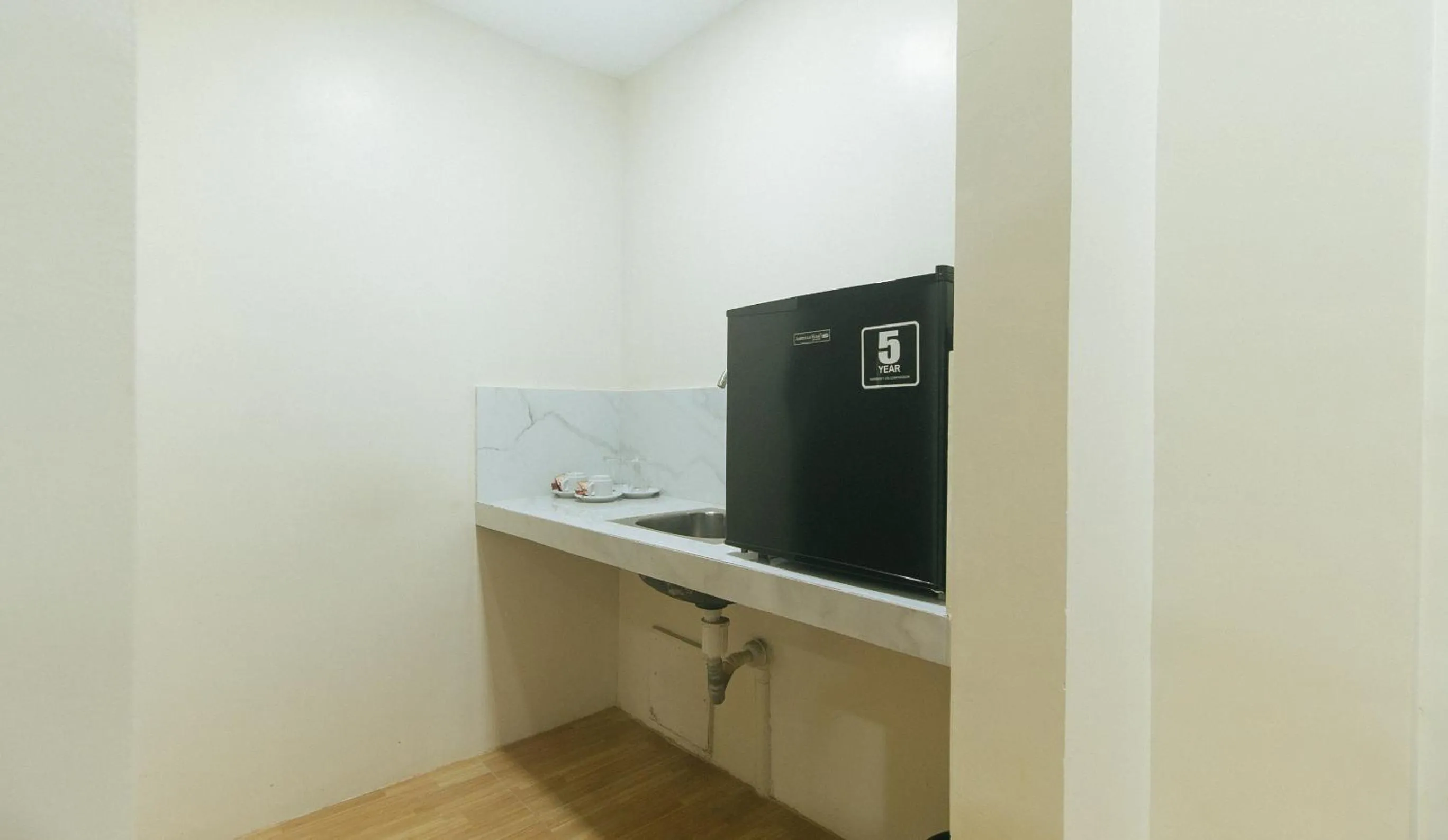 Kitchen or kitchenette in Avelida Homes by RedDoorz