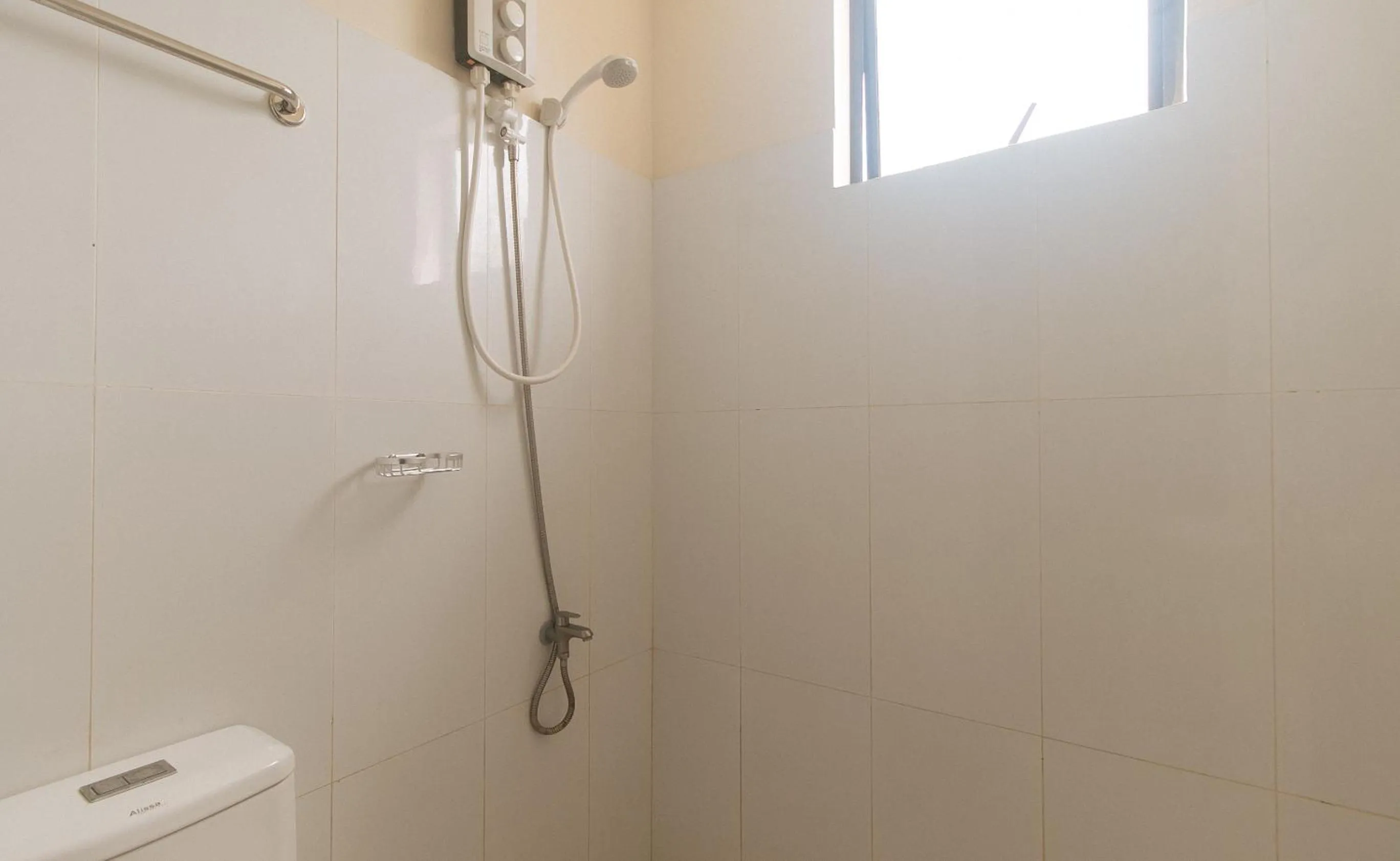 Shower in Avelida Homes by RedDoorz