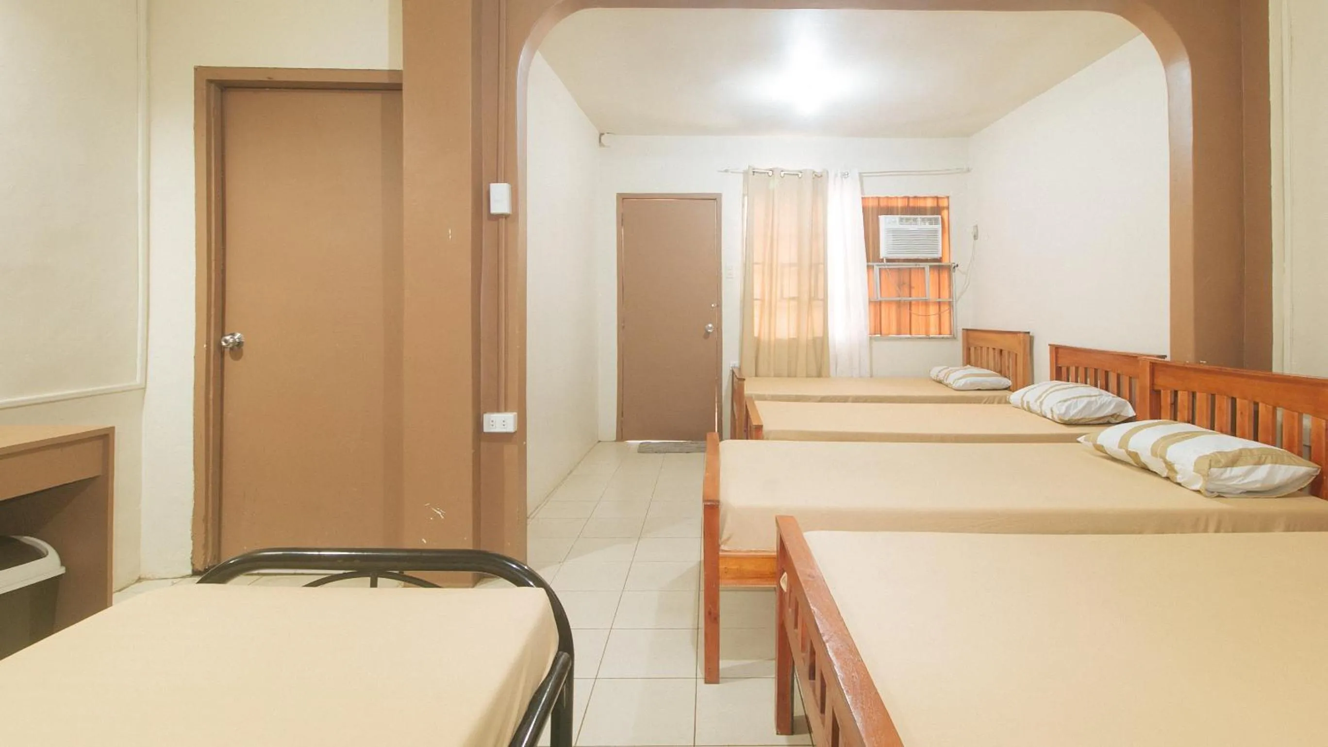 Bedroom, Bed in Kababayan Pensione House by RedDoorz