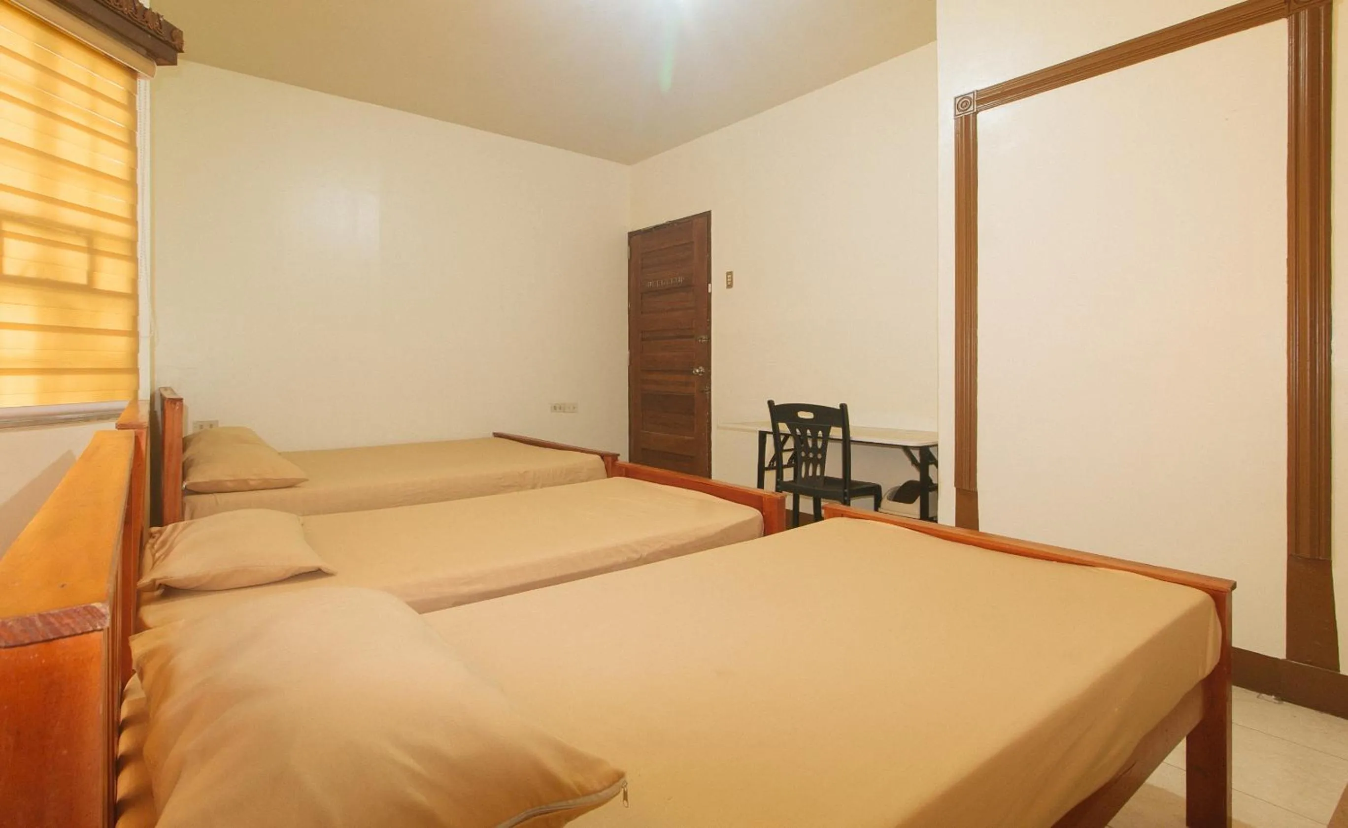 Photo of the whole room, Bed in Kababayan Pensione House by RedDoorz