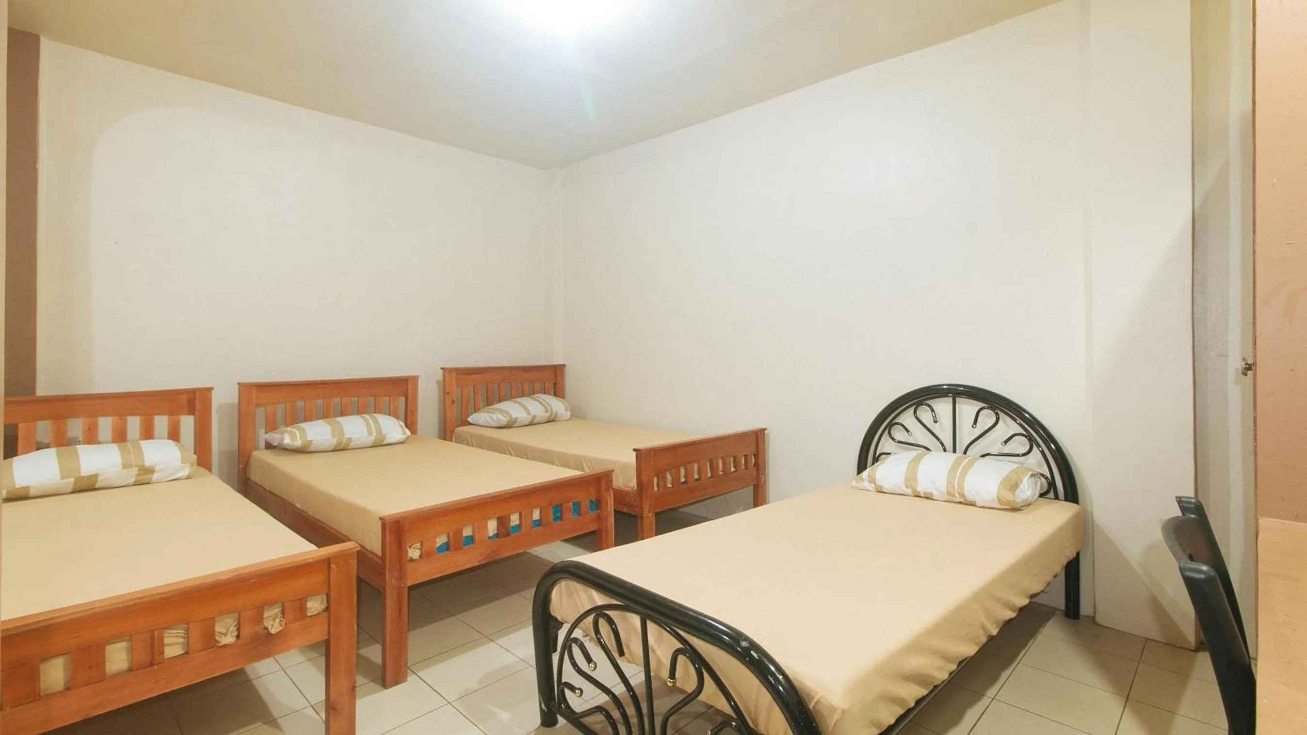 Bedroom, Bed in Kababayan Pensione House by RedDoorz