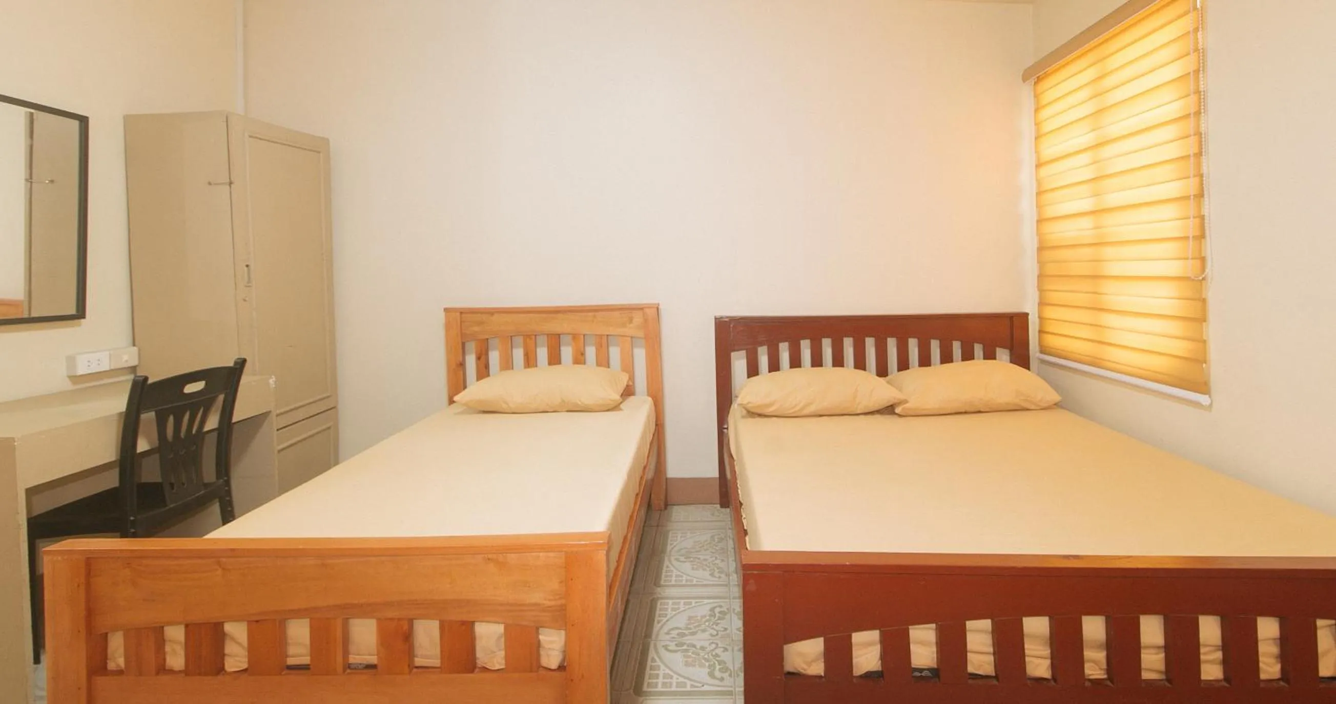 Photo of the whole room, Bed in Kababayan Pensione House by RedDoorz