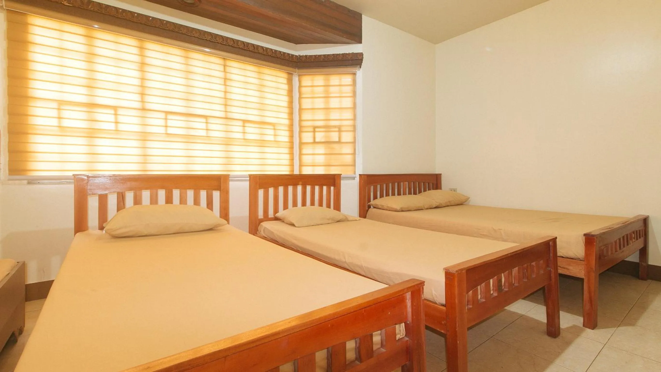 Bedroom, Bed in Kababayan Pensione House by RedDoorz