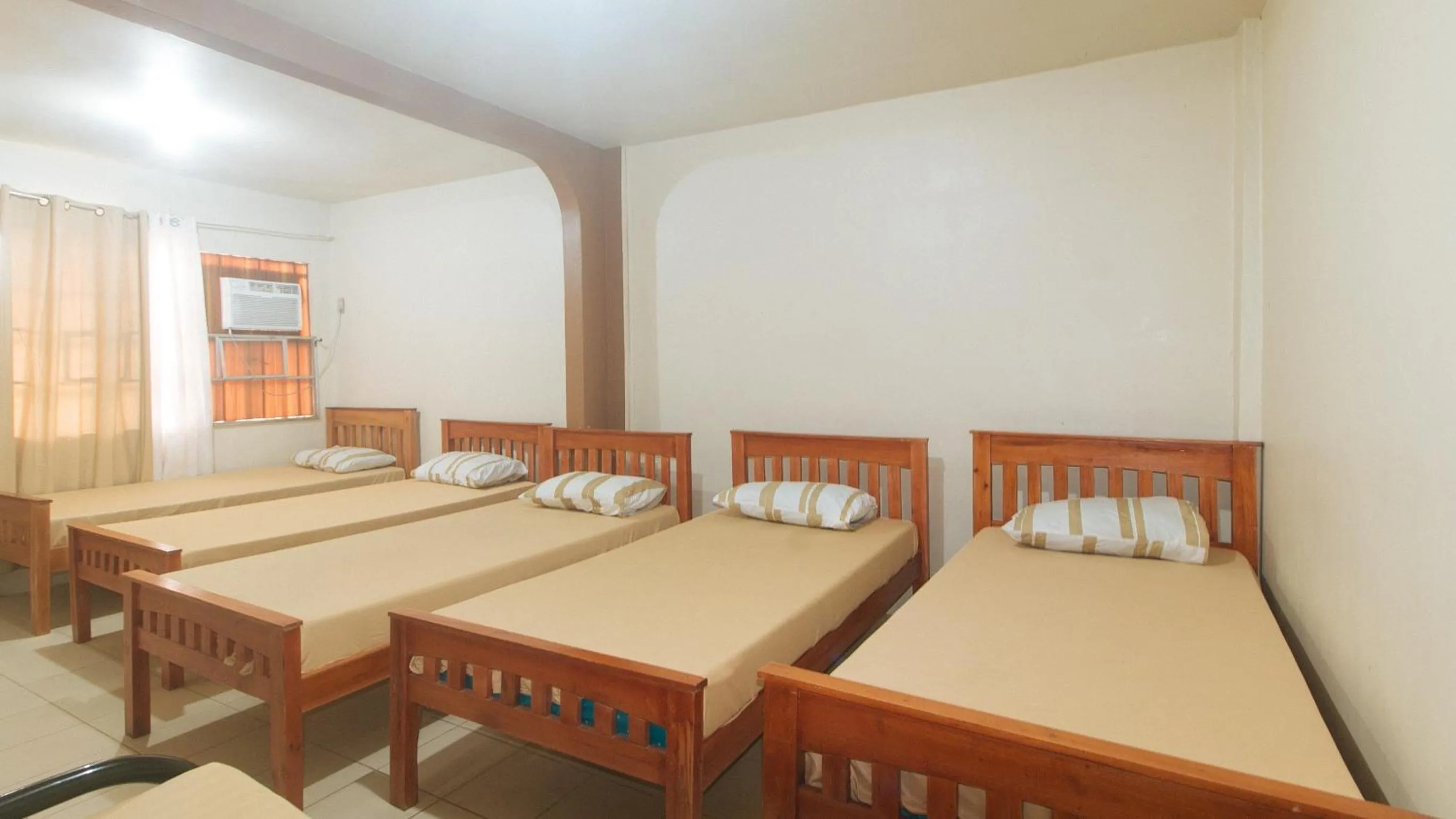 Bedroom, Bed in Kababayan Pensione House by RedDoorz