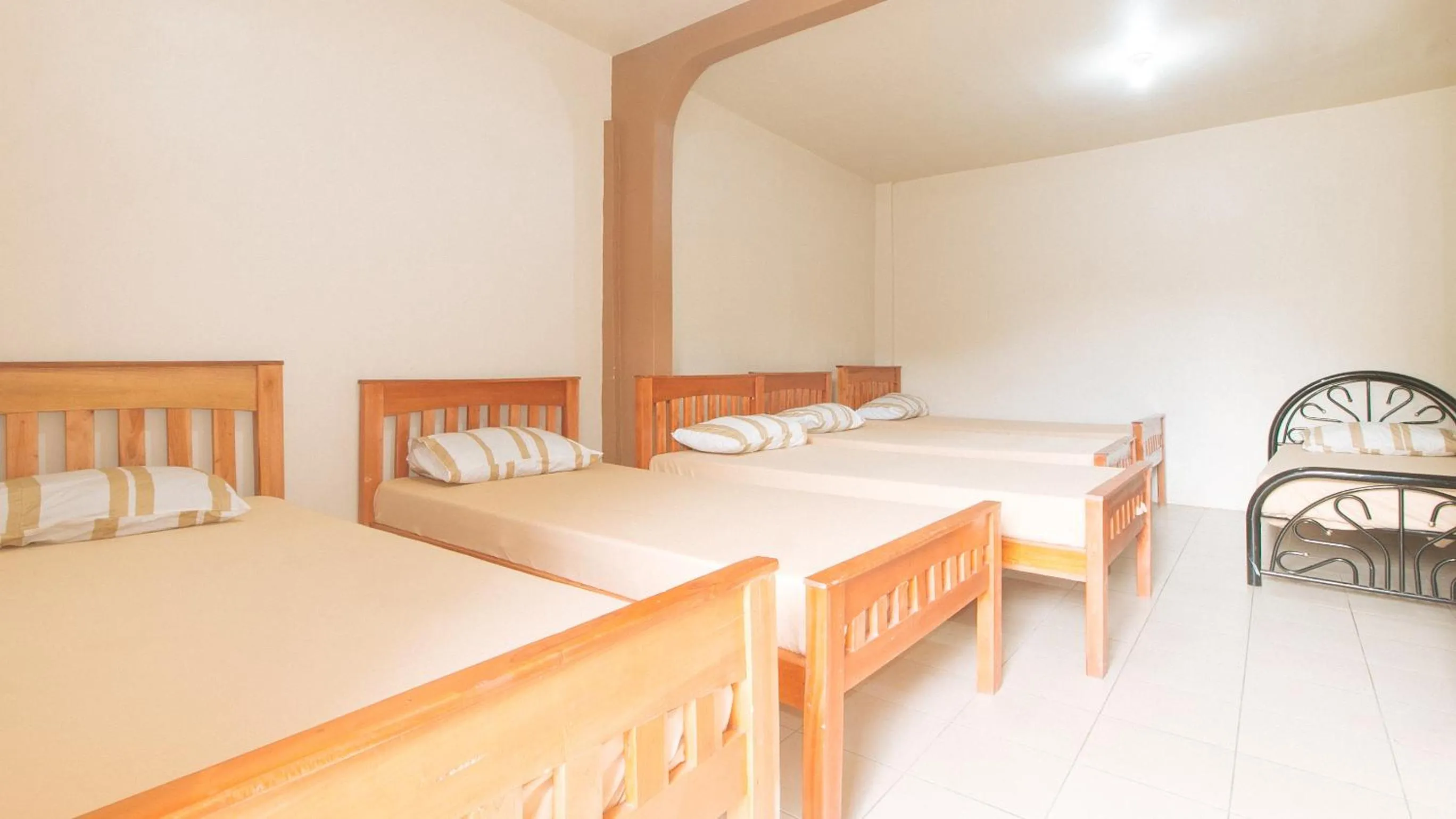 Bed in Kababayan Pensione House by RedDoorz