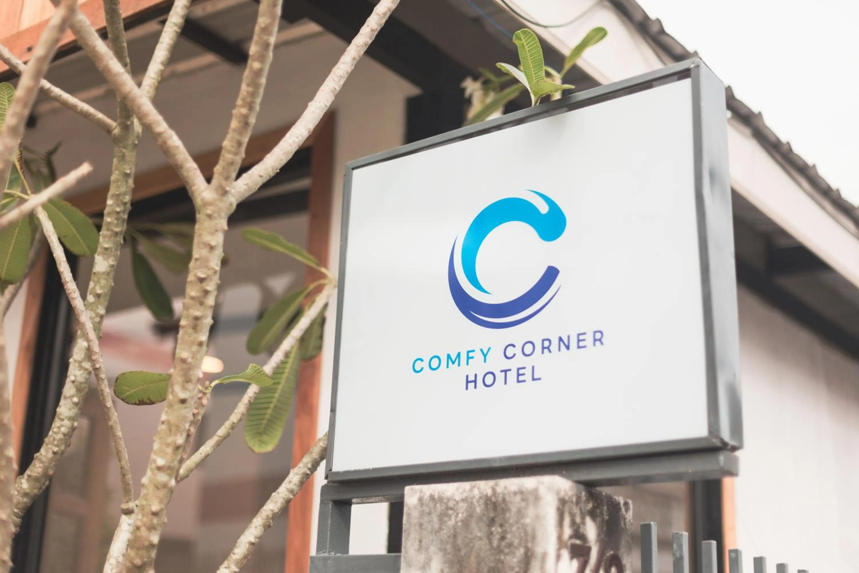 Property logo or sign in Comfy Corner Hotel