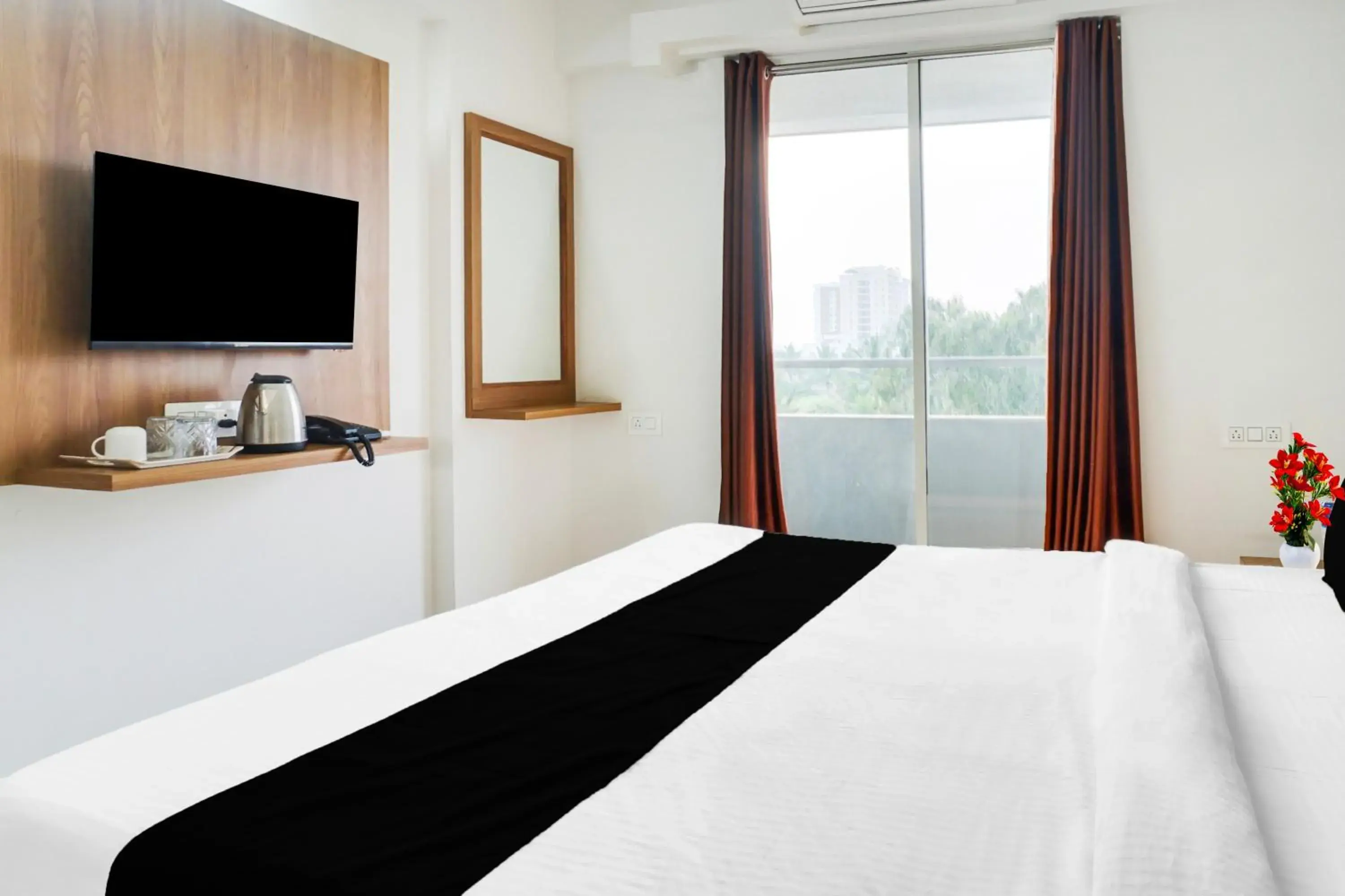 Bedroom, Bed in Super Townhouse Lohegaon Near Pune Airport formerly Landmark Regency Bedroom, Bed in Super Townhouse Lohegaon Near Pune Airport formerly Landmark Regency