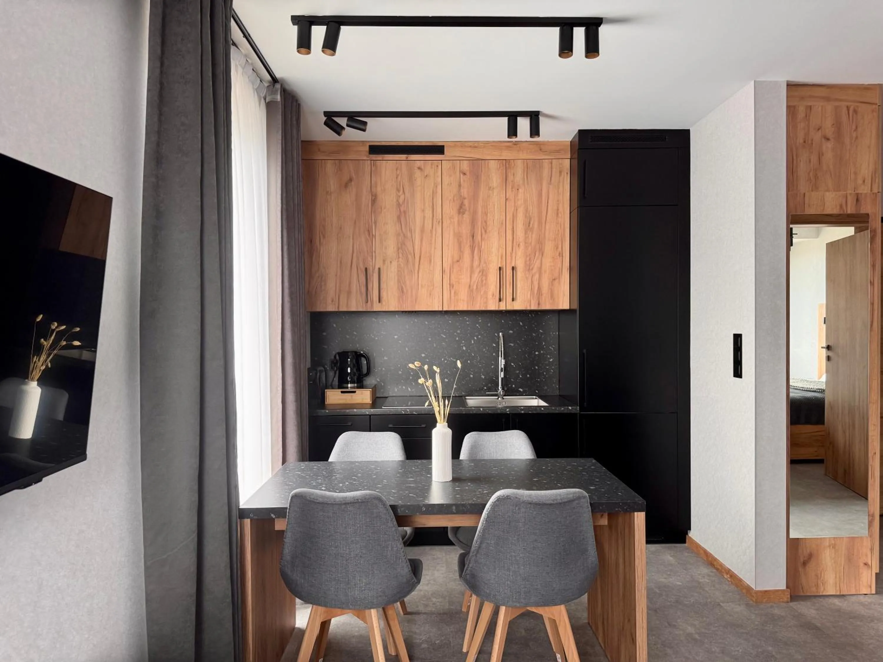 Kitchen or kitchenette in Cyrhla Apartamenty - sauna, playroom, free parking & wifi