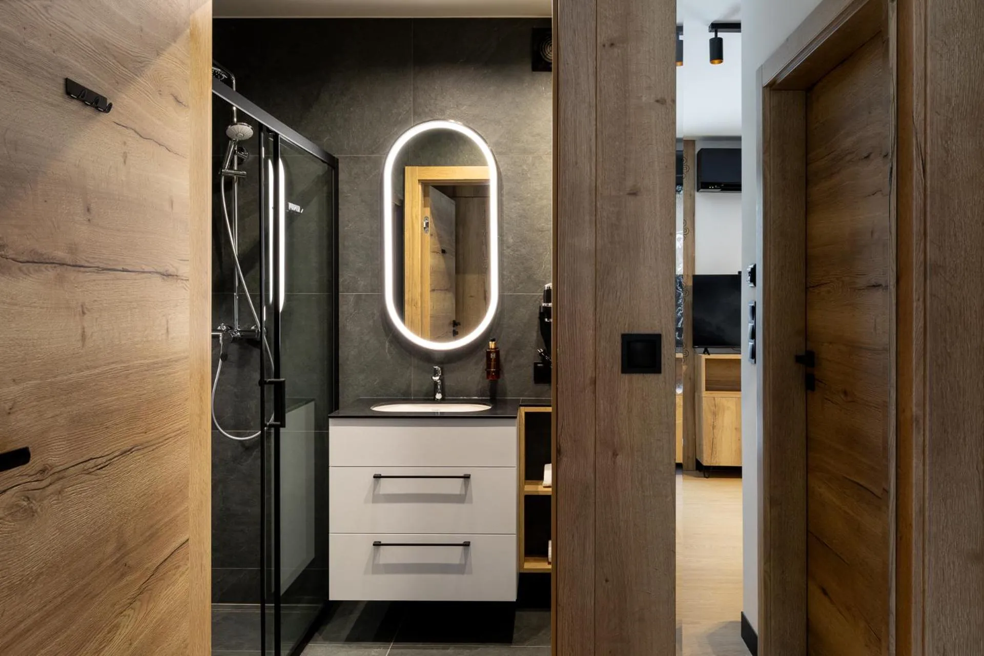 Shower in Cyrhla Apartamenty - sauna, playroom, free parking & wifi
