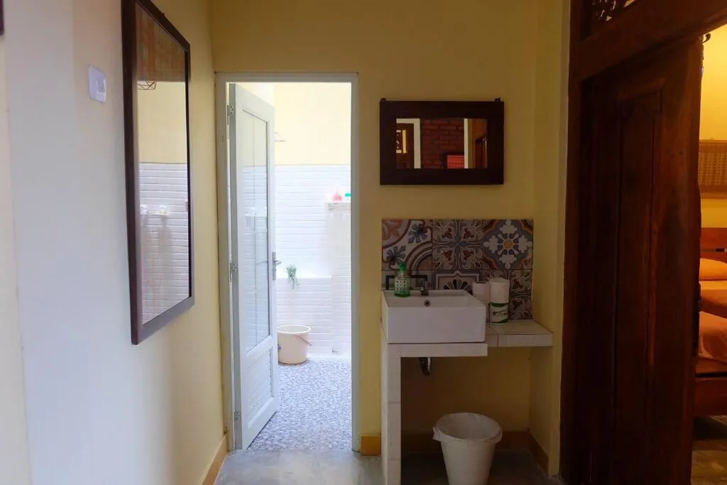 Toilet in Sabi House Lesmana 2 by Simply Homy