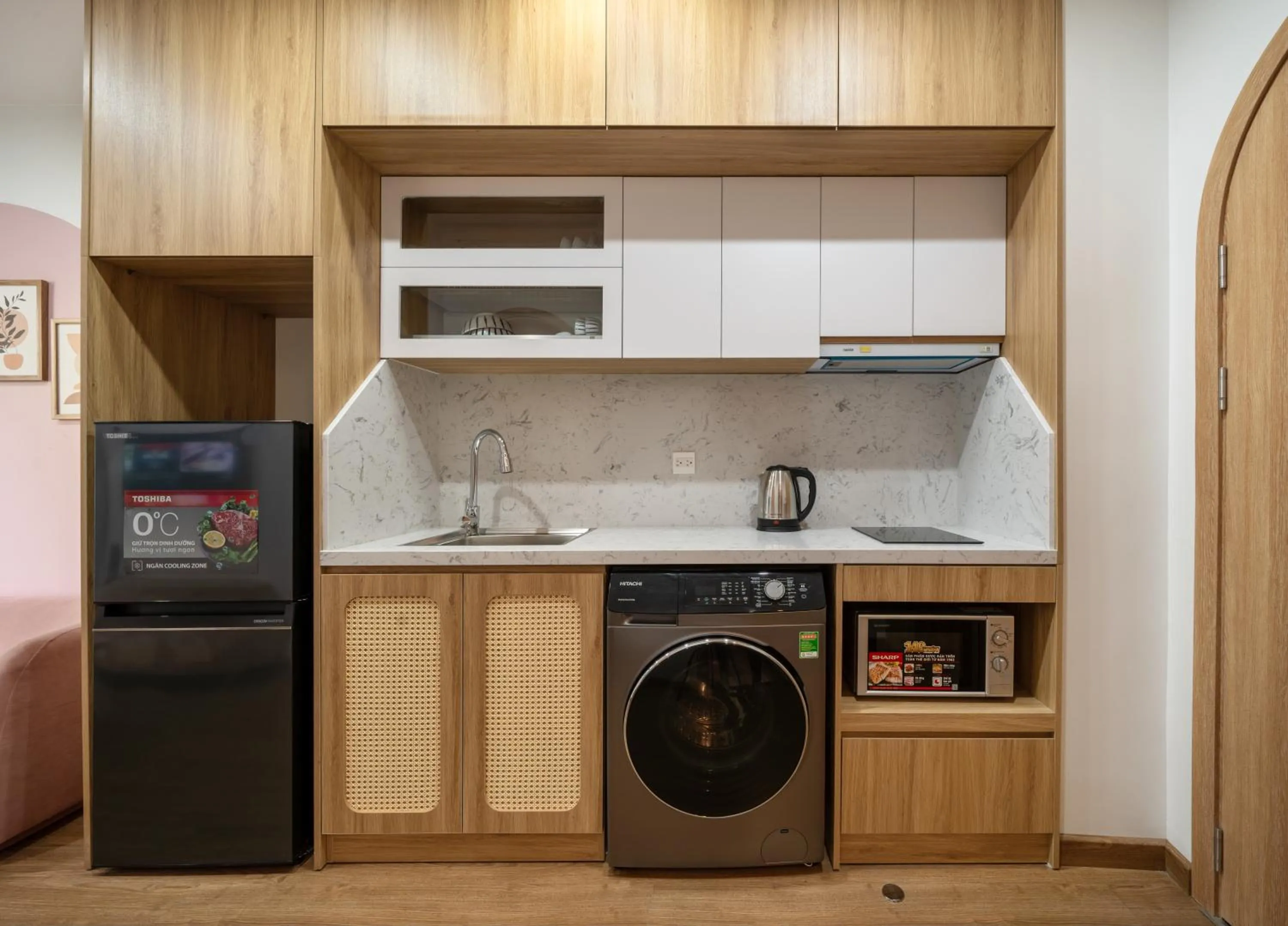 Kitchen or kitchenette in MOONLIT Suites Hotel by Luxe Paradise