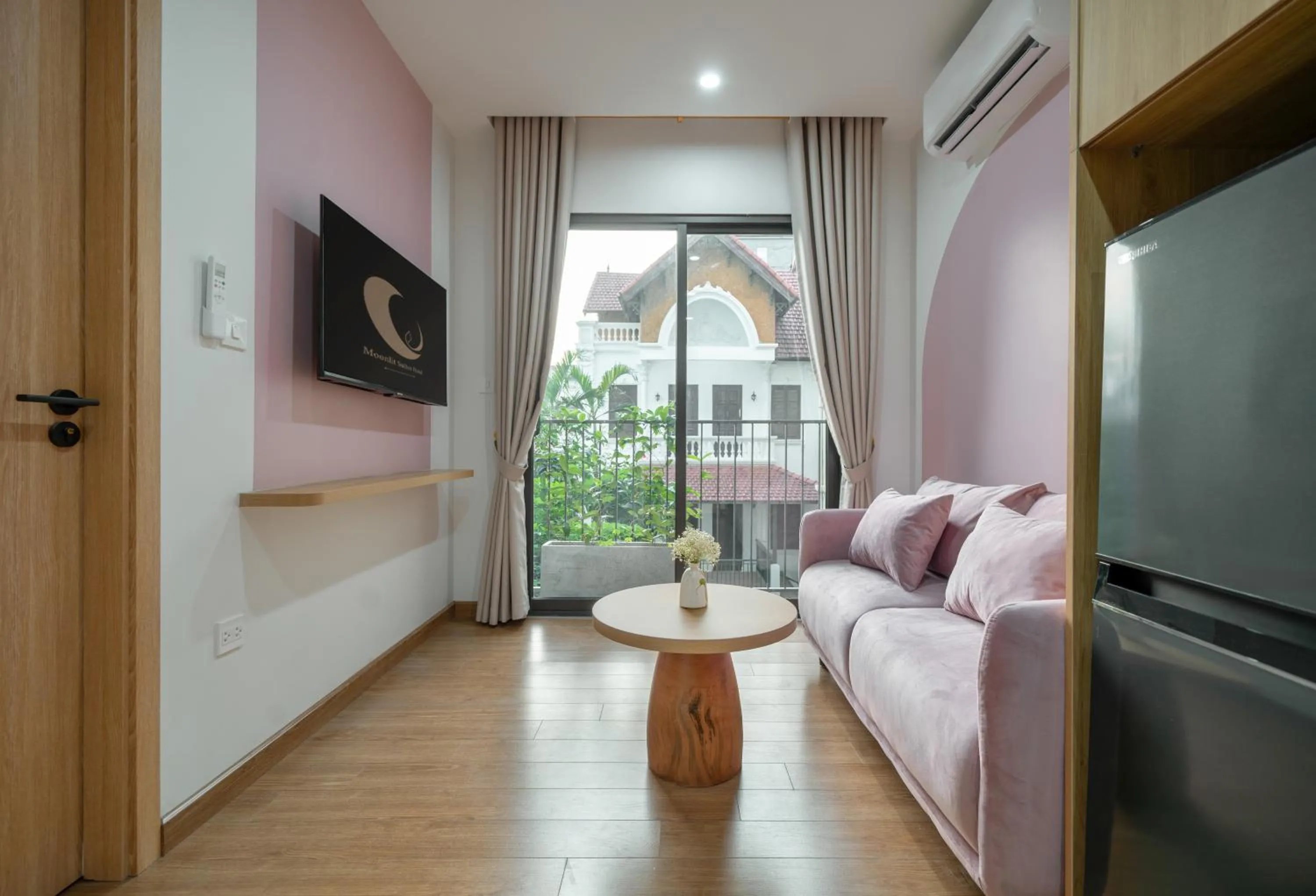 TV and multimedia in MOONLIT Suites Hotel by Luxe Paradise