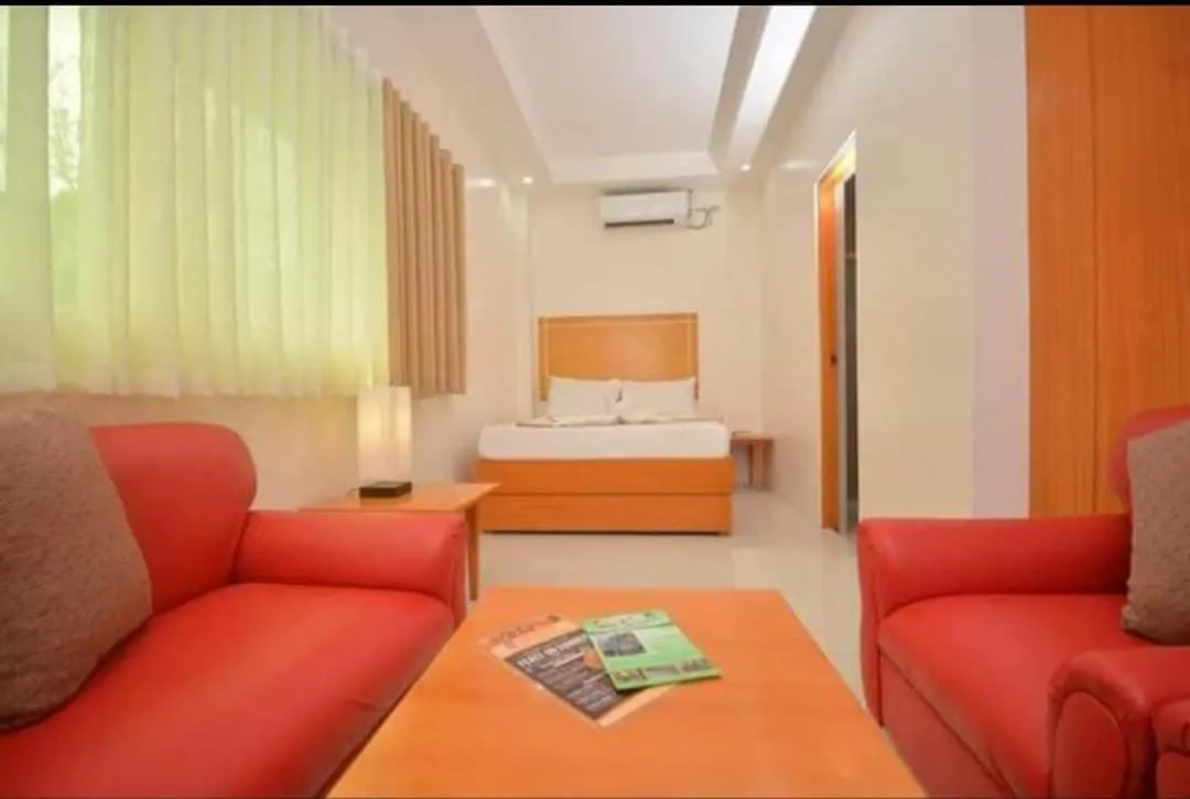 Bed in Cherry's Courtyard Hotel