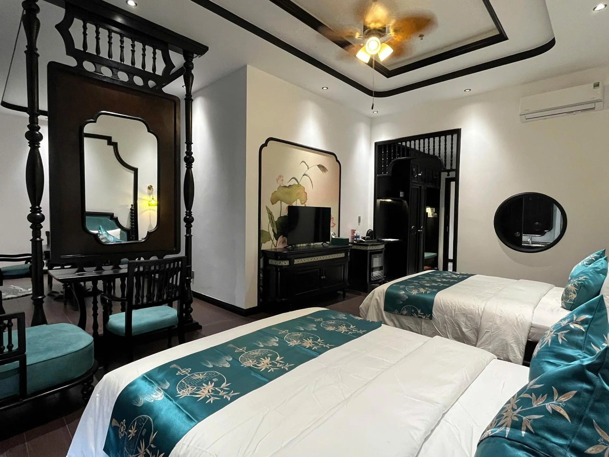 Bed in MAISON CAMELLIA Hotel