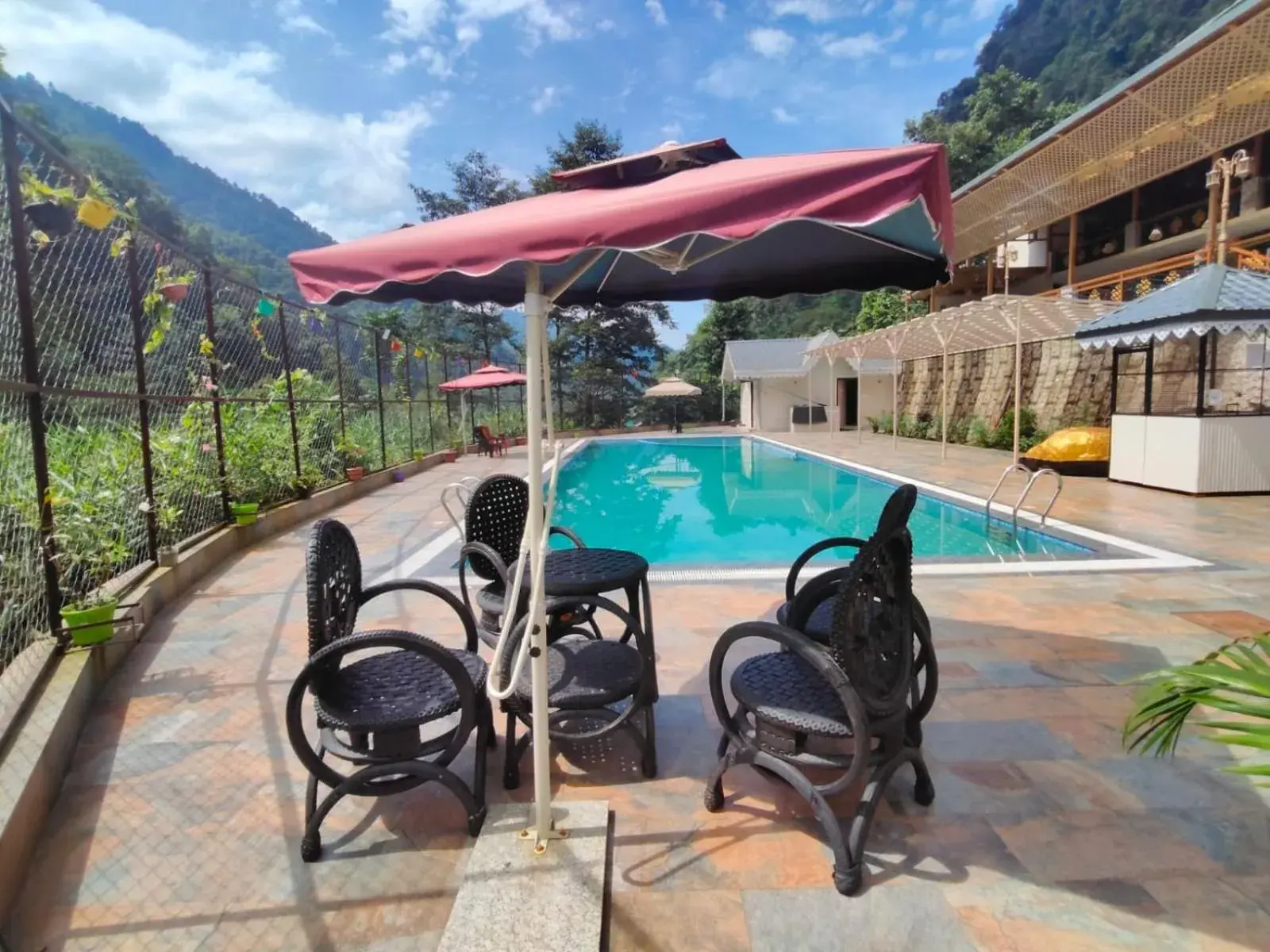 Pool view in Nature's Nest Resort Pool view in Nature's Nest Resort