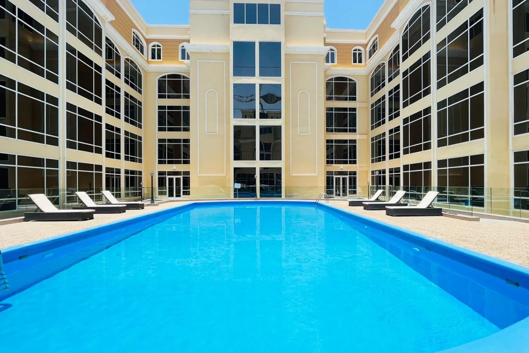 Swimming pool in Livbnb-Spacious JVC Studio, Near Dining and Shops
