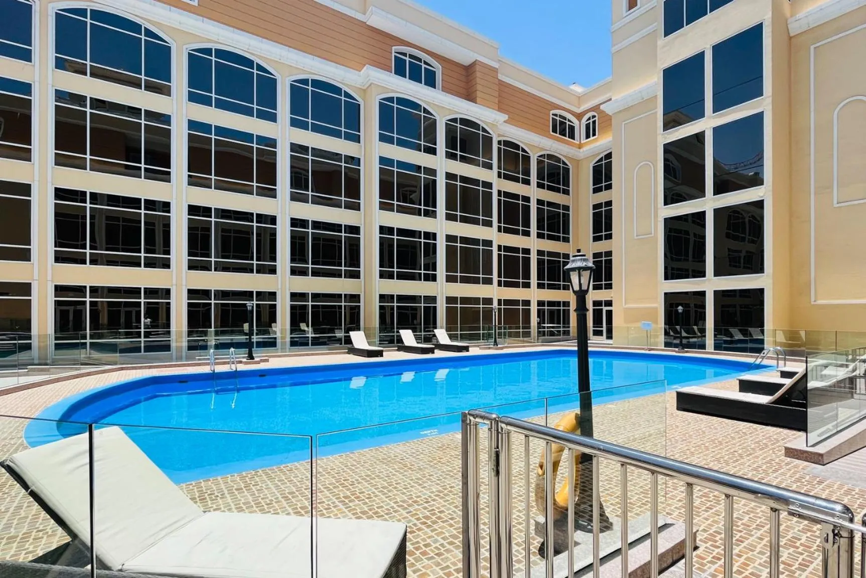 Swimming pool in Livbnb-Spacious JVC Studio, Near Dining and Shops