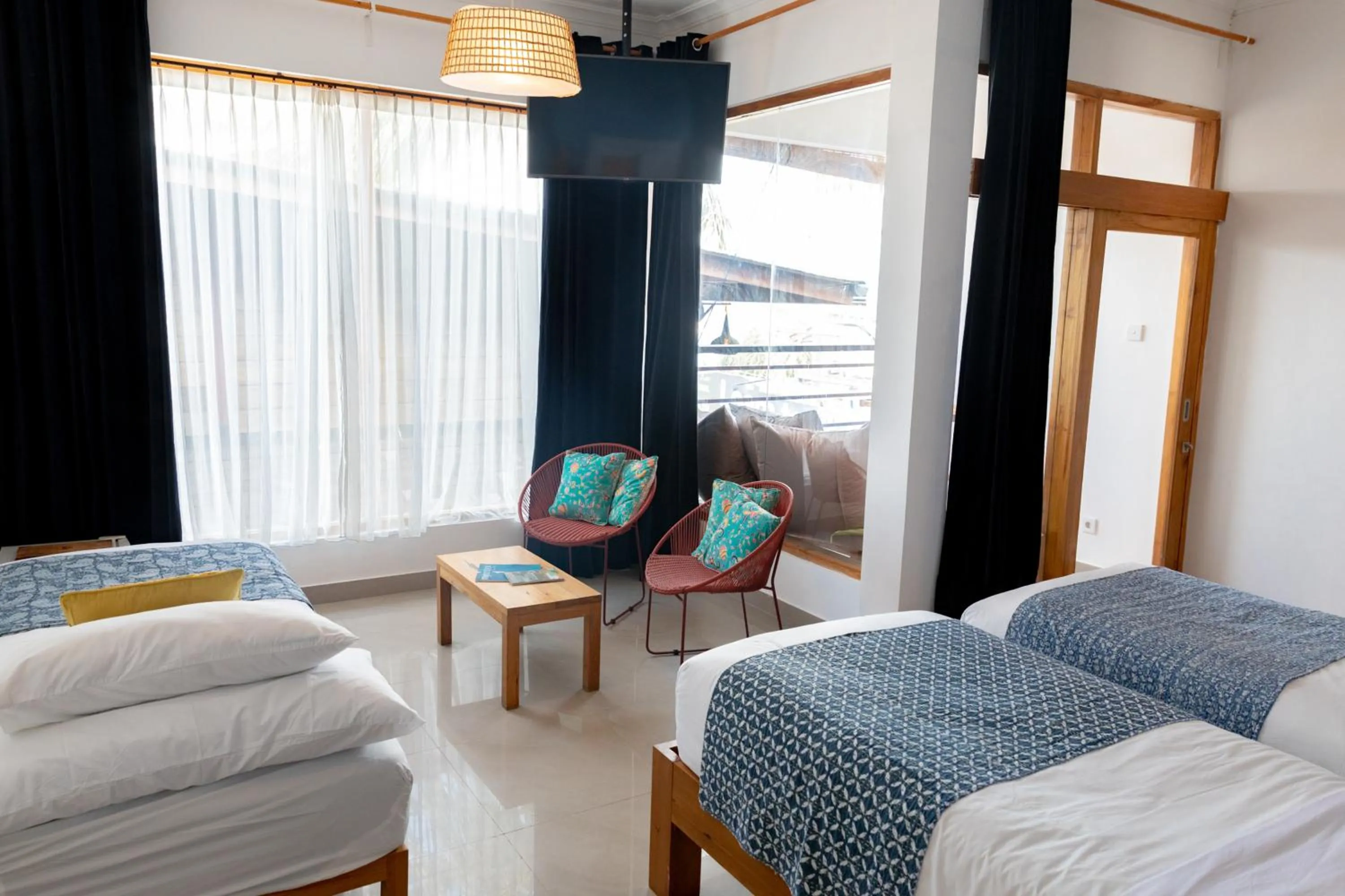 Seating area, Bed in Pesona Beach Resort & Spa - Adults Only