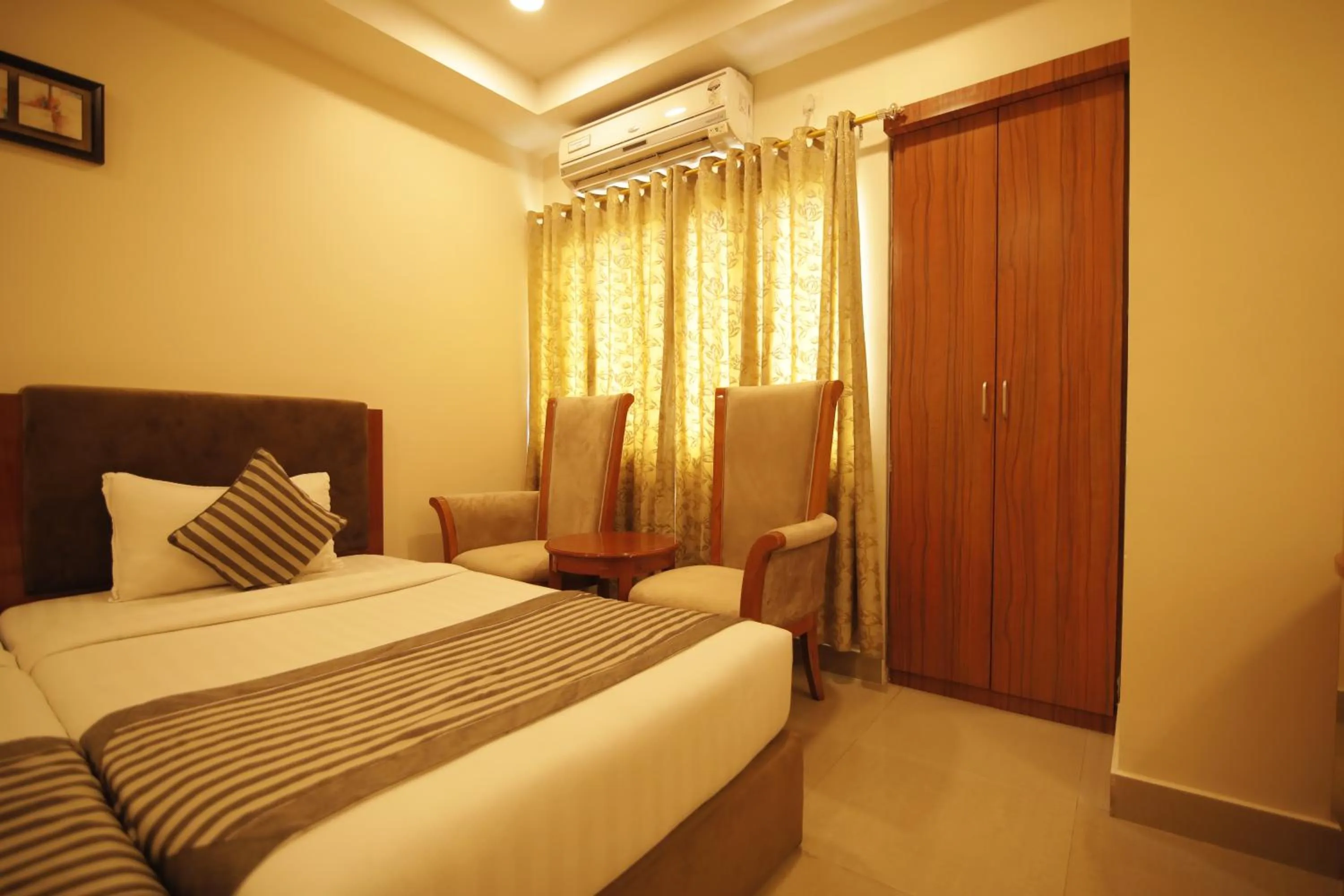 Bed in Hotel KRC Palace