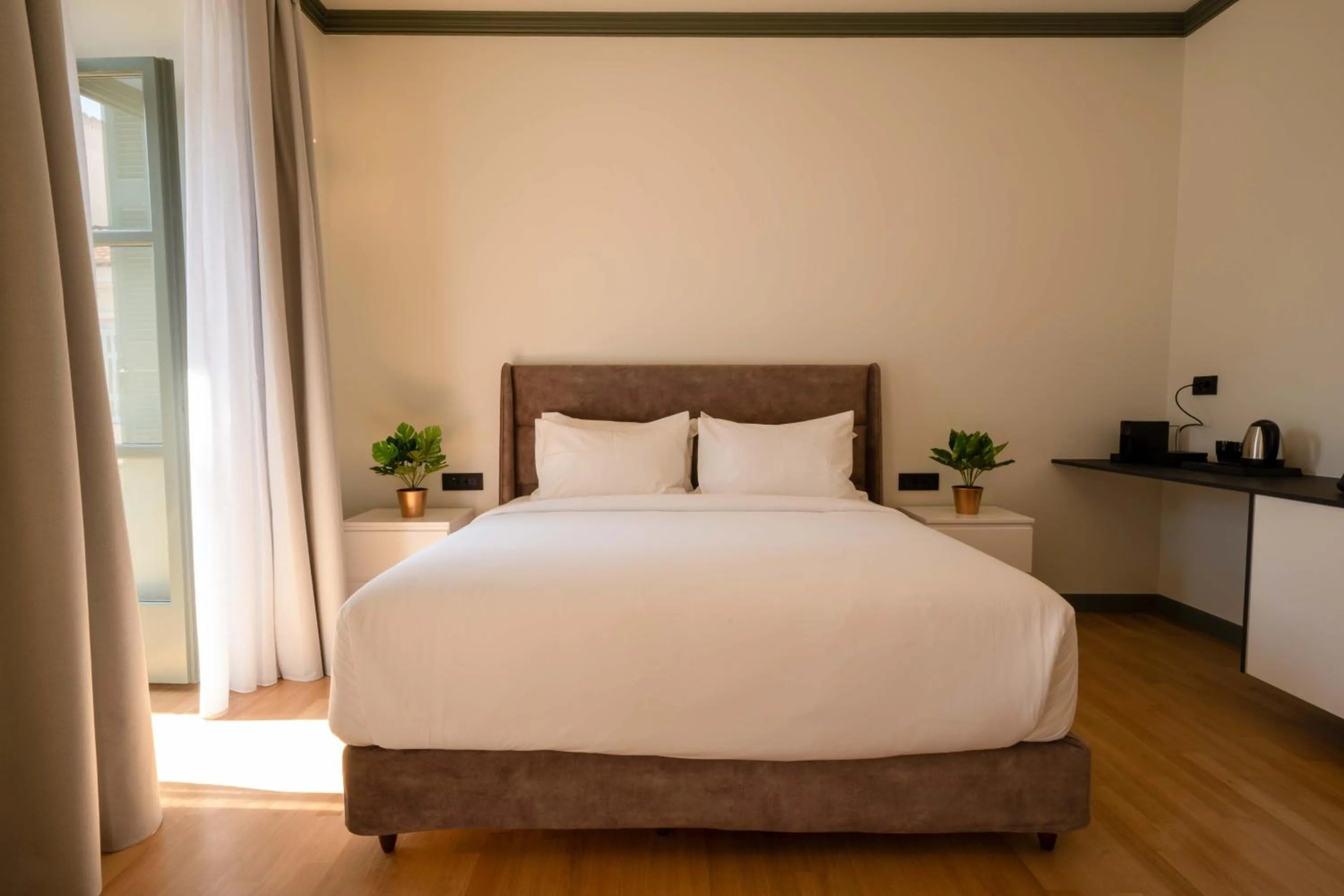 Bed in Whisper Athens Suites