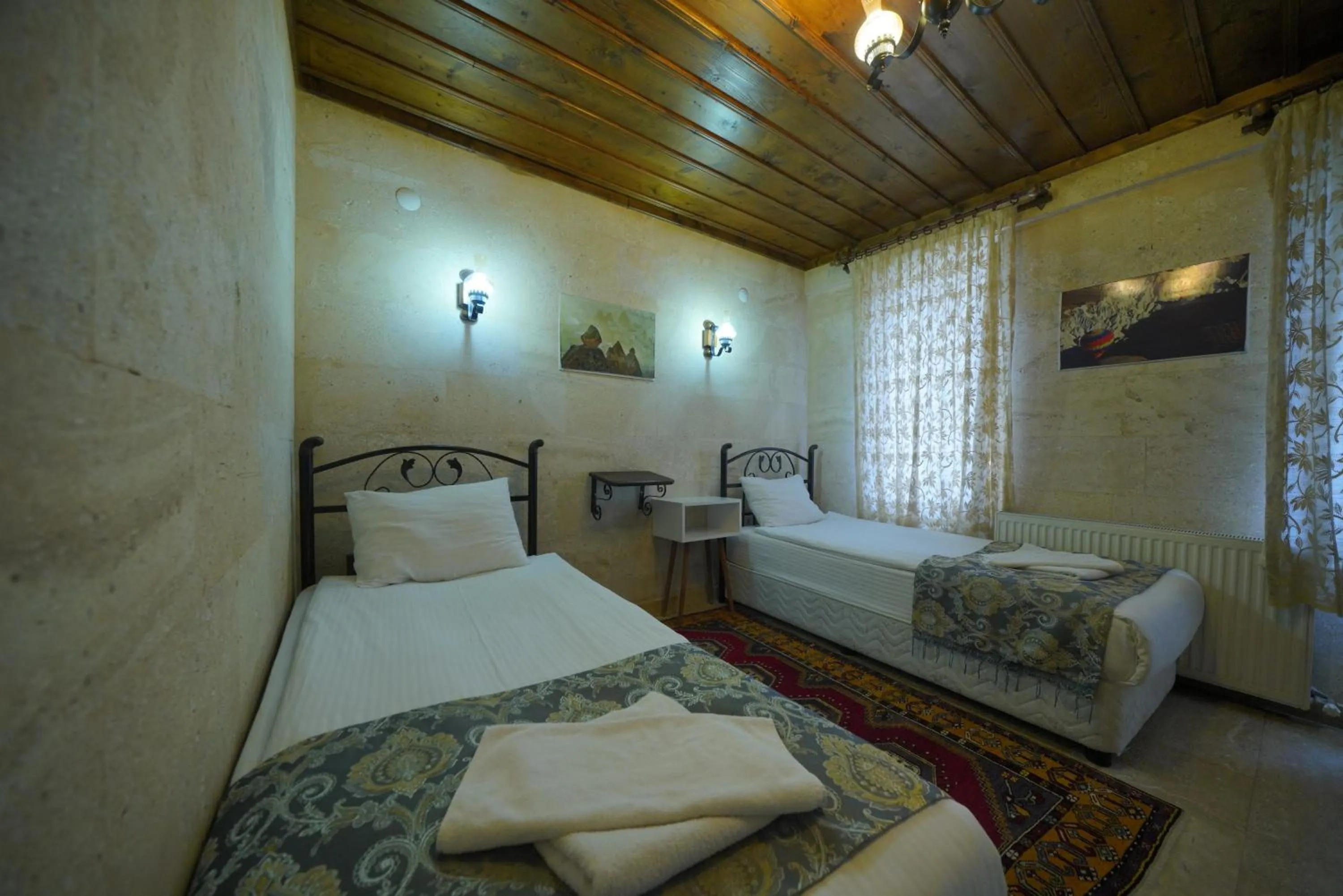 Bed in Goreme Cave Rooms&Pool