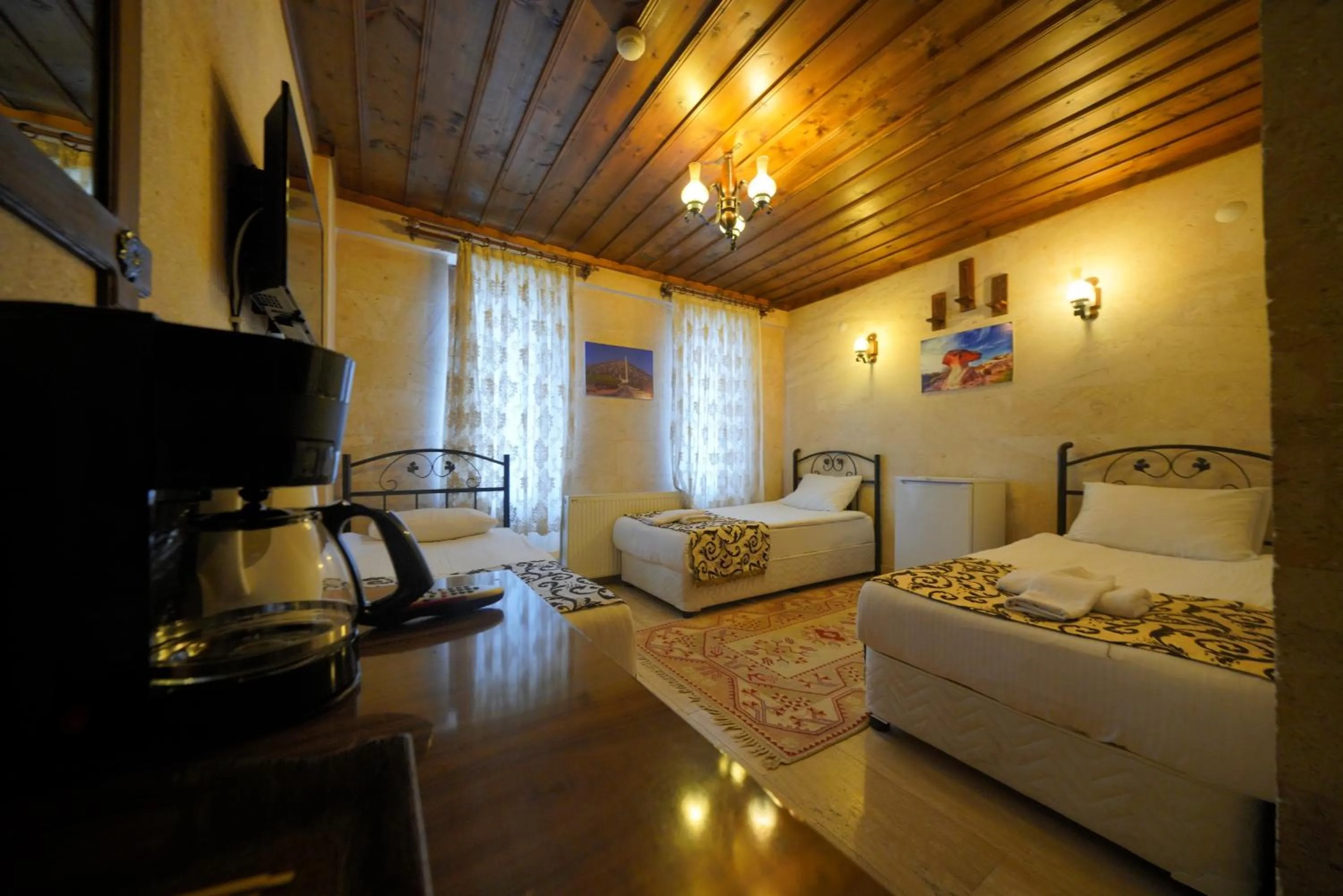 Bed in Goreme Cave Rooms&Pool