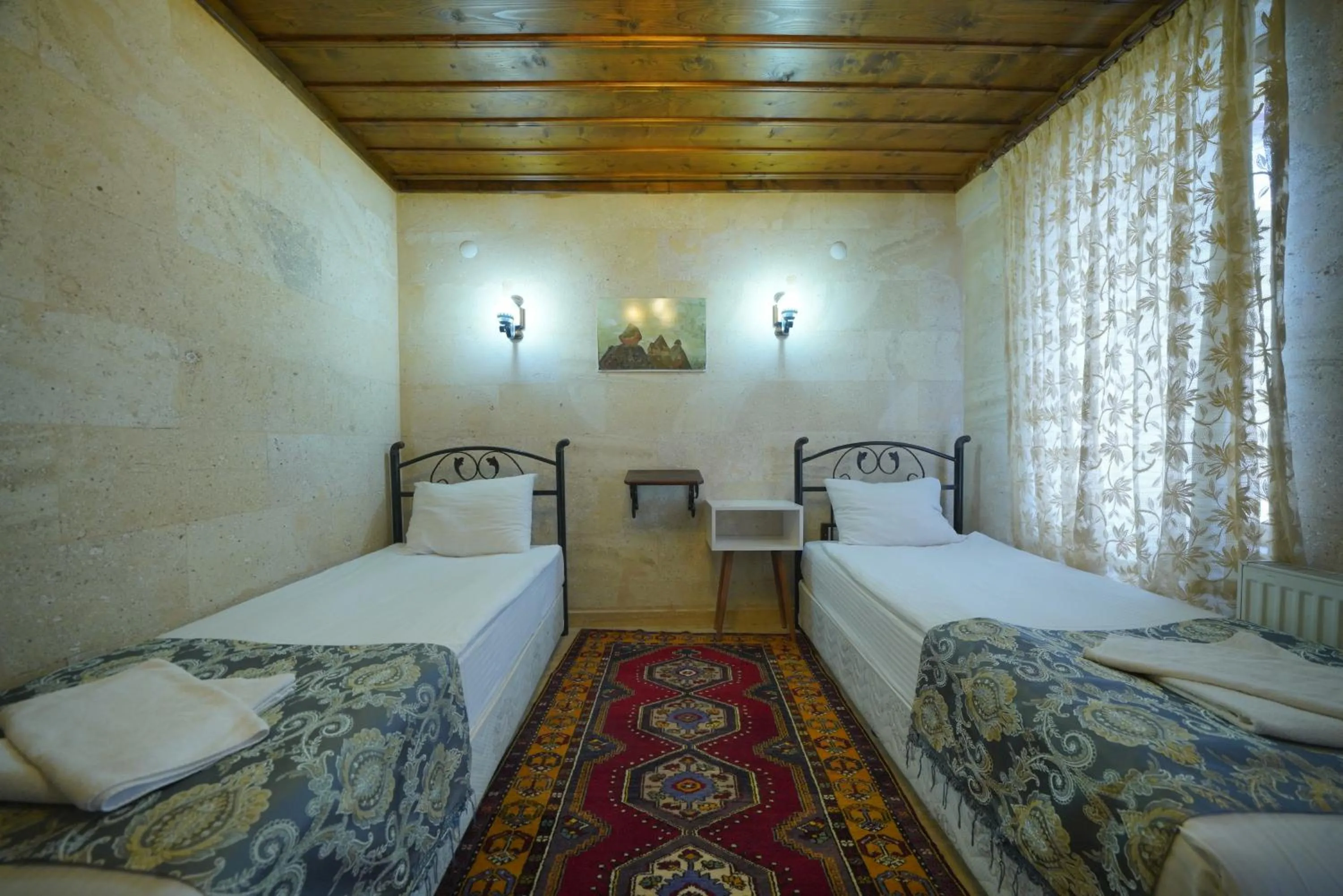 Bed in Goreme Cave Rooms&Pool