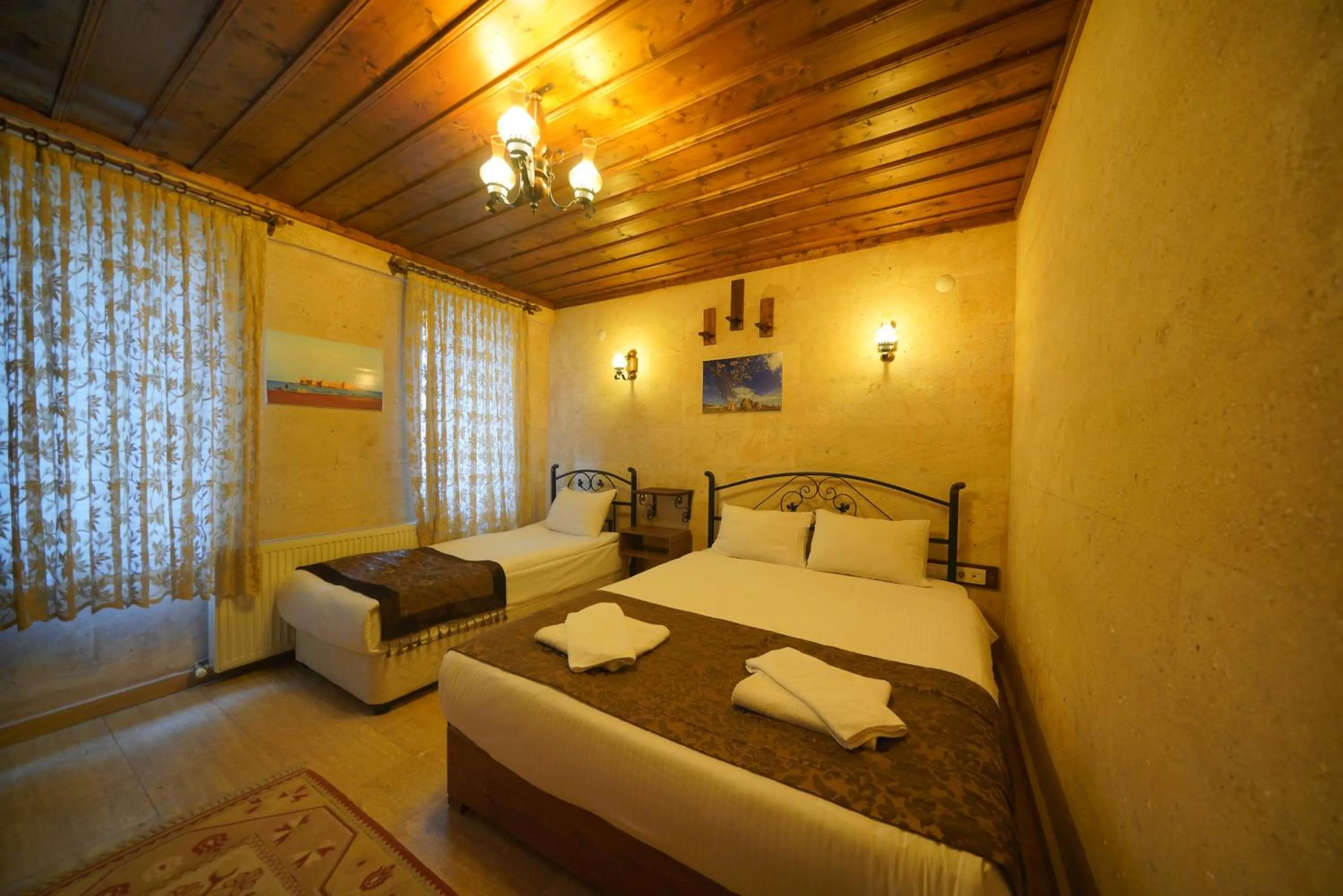 Bed in Goreme Cave Rooms&Pool