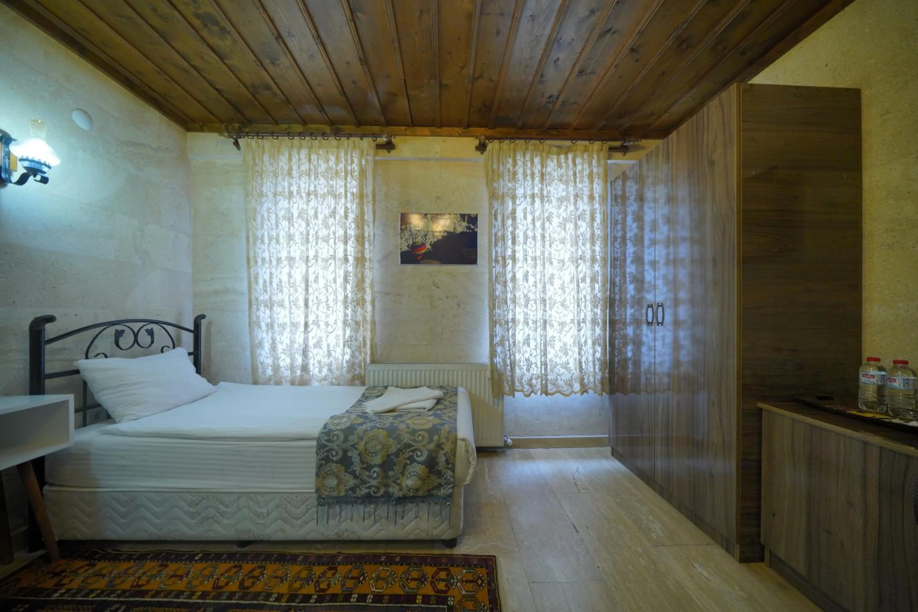 Bed in Goreme Cave Rooms&Pool