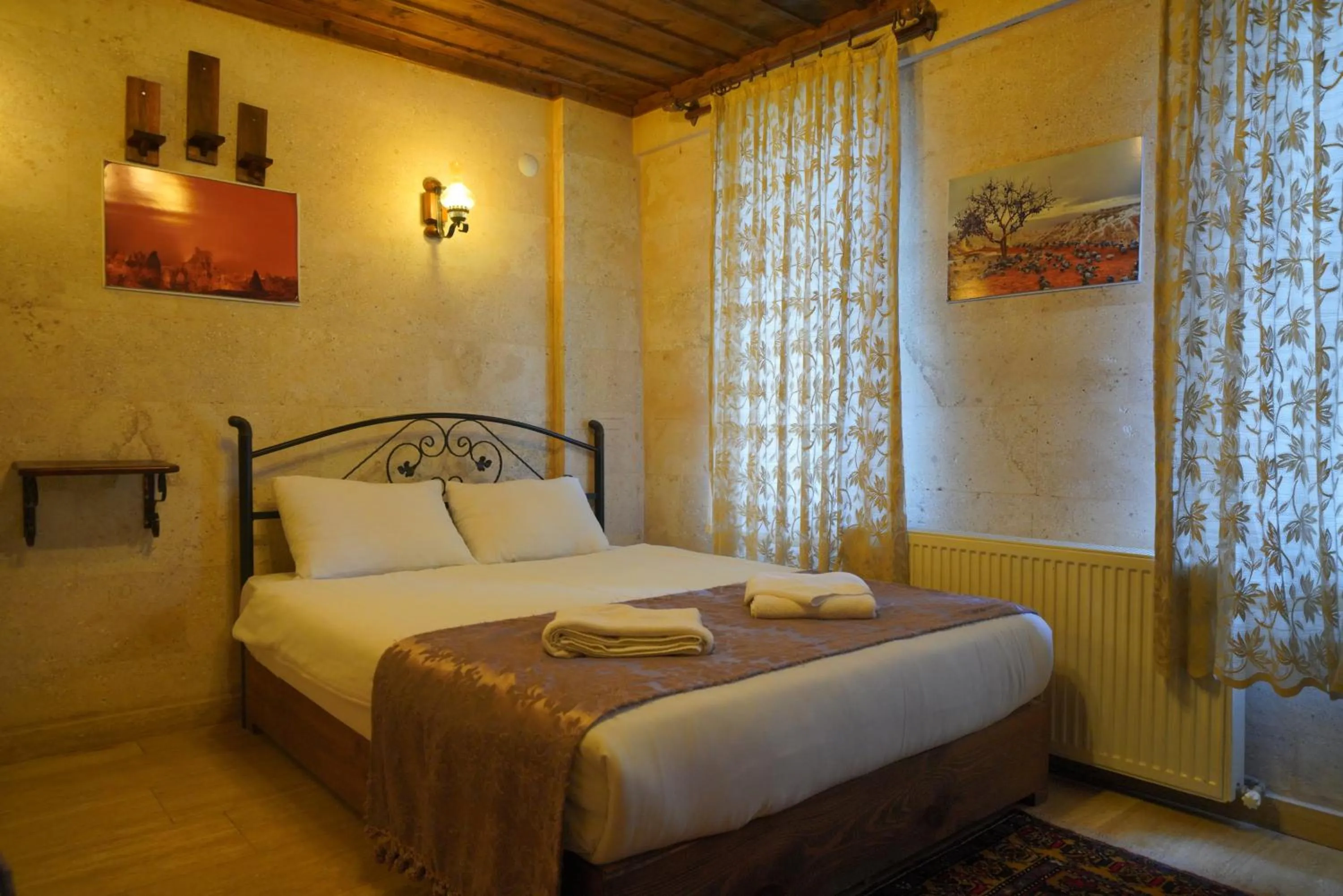 Bed in Goreme Cave Rooms&Pool