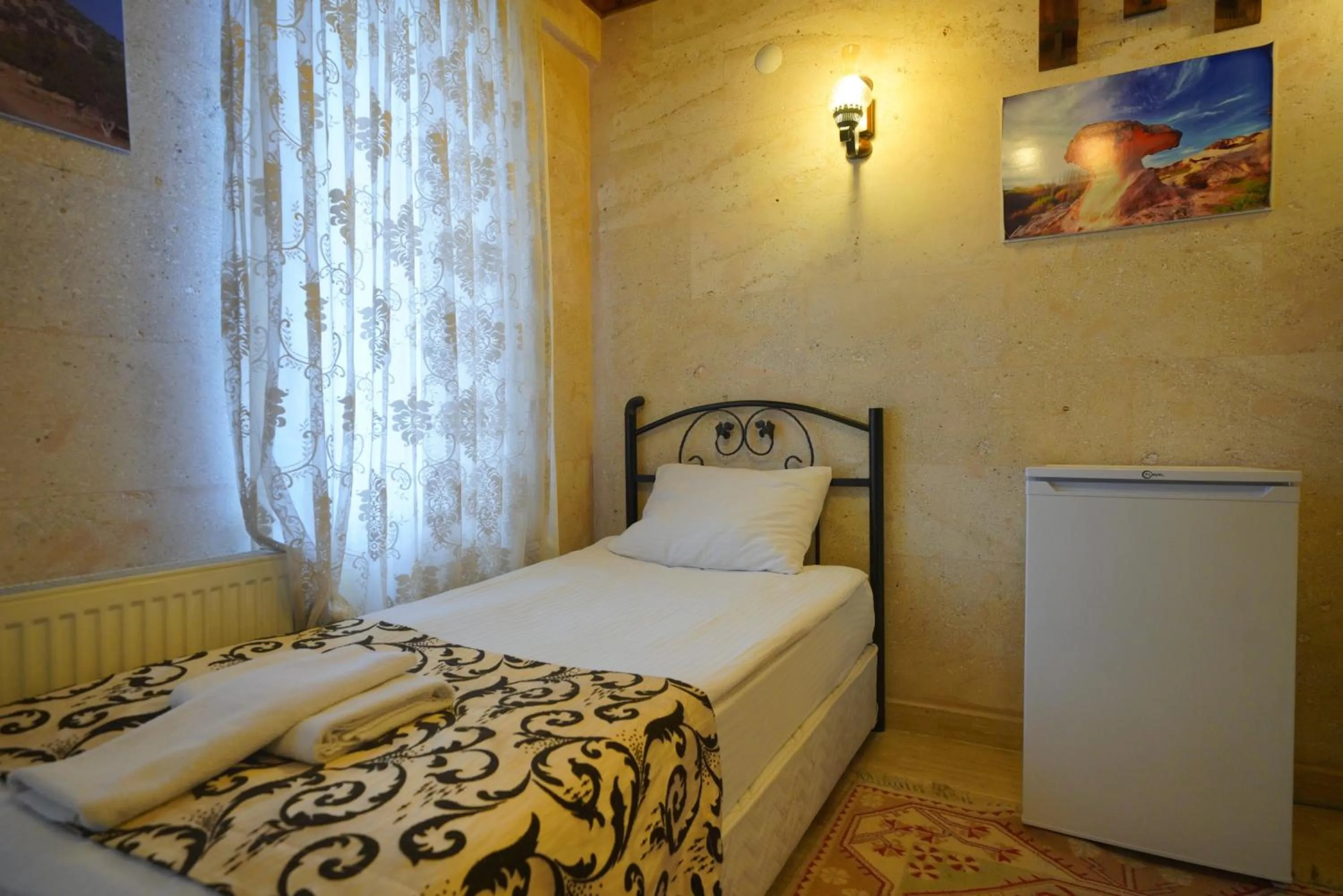 Bed in Goreme Cave Rooms&Pool